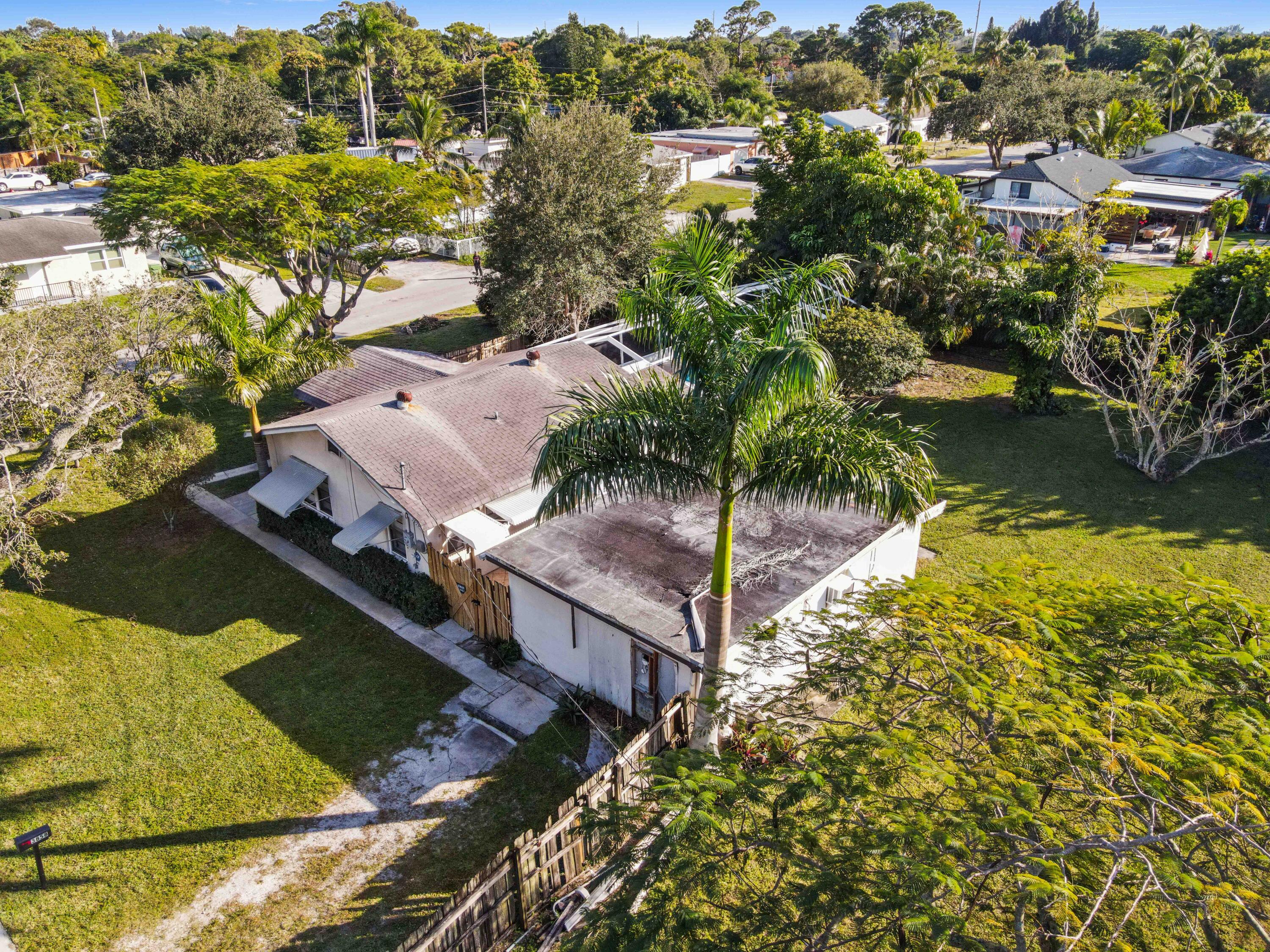 3858 Lakewood Road Palm Springs, FL 33461 - Photo 39 of 39 an aerial view of residential houses with outdoor space and swimming pool