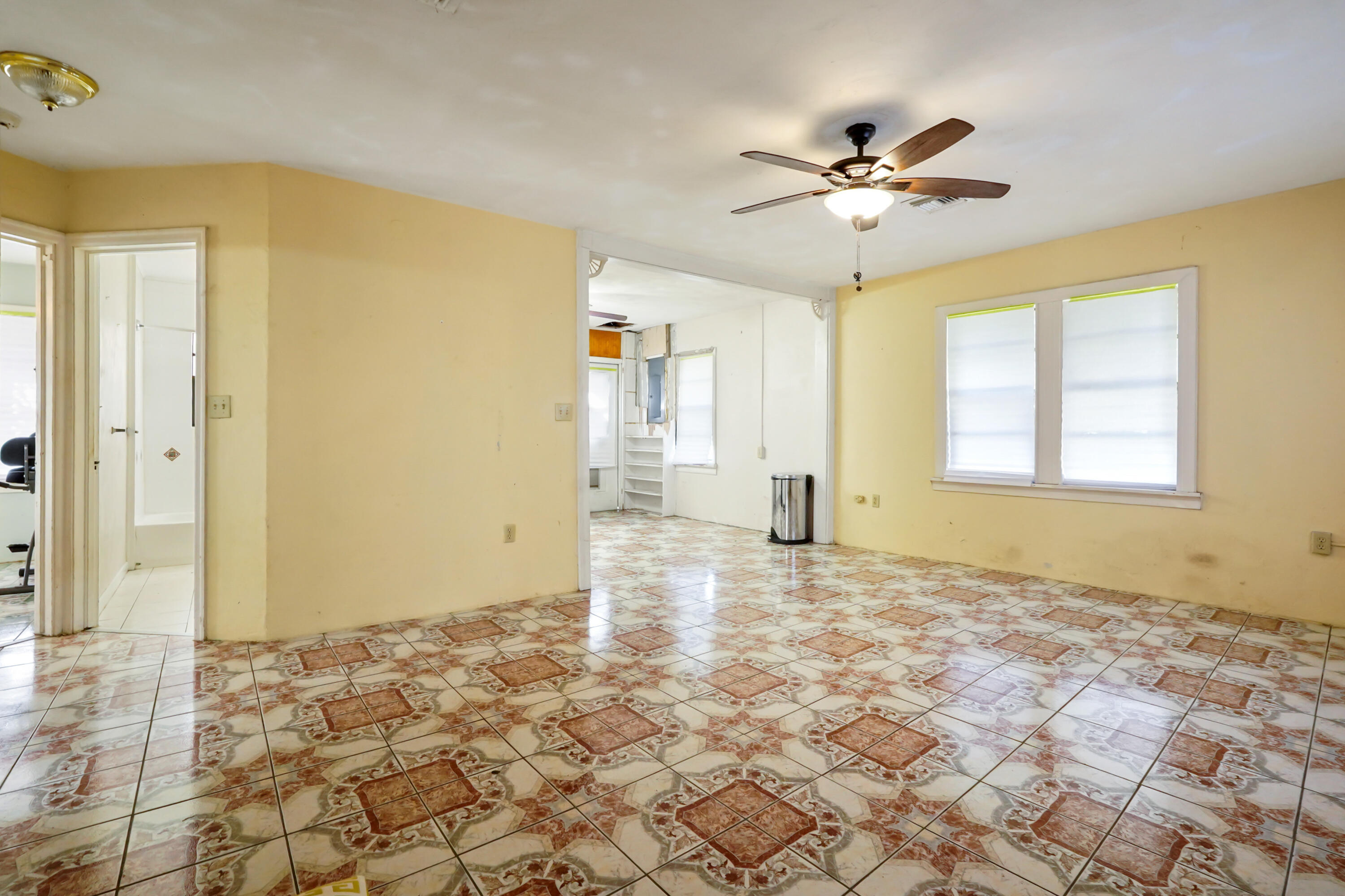 3858 Lakewood Road Palm Springs, FL 33461 - Photo 6 of 39 a view of a livingroom with a ceiling fan and window