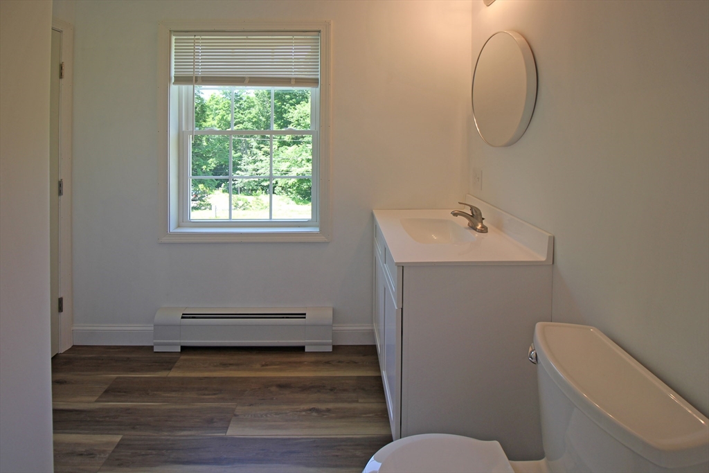 12 Pine Road Williamsburg, MA 01096 - Photo 11 of 24 a bathroom with a toilet a sink and mirror