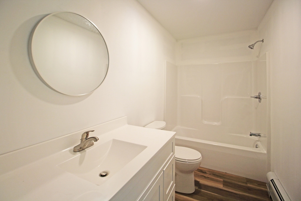 12 Pine Road Williamsburg, MA 01096 - Photo 14 of 24 a bathroom with a sink a toilet and a mirror