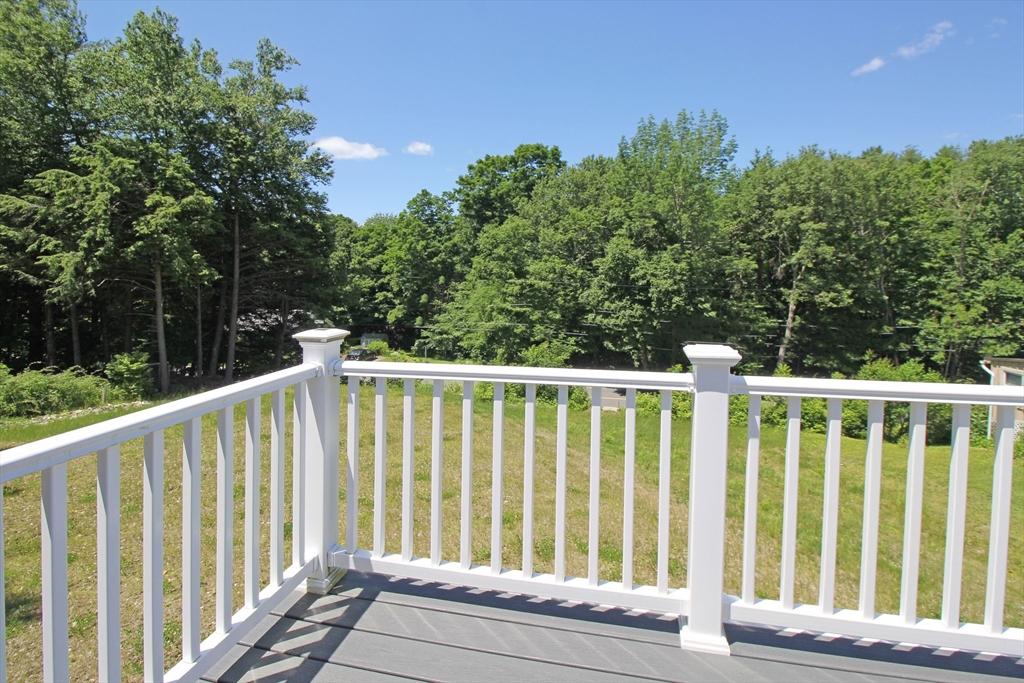 12 Pine Road Williamsburg, MA 01096 - Photo 20 of 24 a balcony with trees in front of it