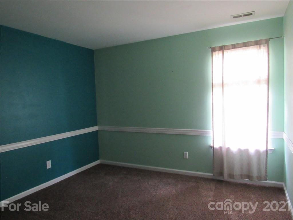 116 Royalton Road Mooresville, NC 28115 - Photo 11 of 12 a view of an empty room with a window