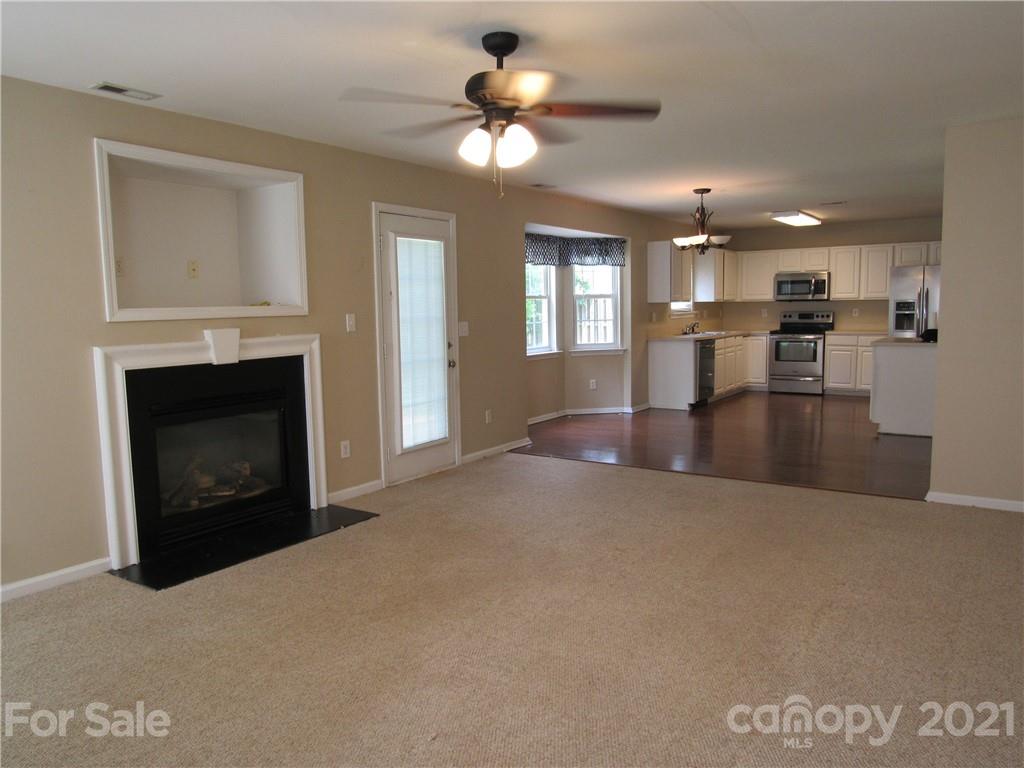 116 Royalton Road Mooresville, NC 28115 - Photo 6 of 12 a living room with furniture and a fireplace