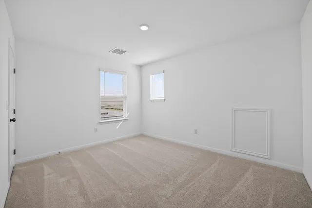 a bathroom with a sink mirror and toilet