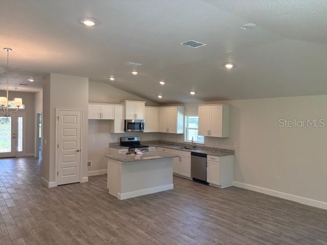 7625 Southwest 180th Circle Dunnellon, FL 34432 - Photo 4 of 21 a kitchen with stainless steel appliances granite countertop a sink and cabinets