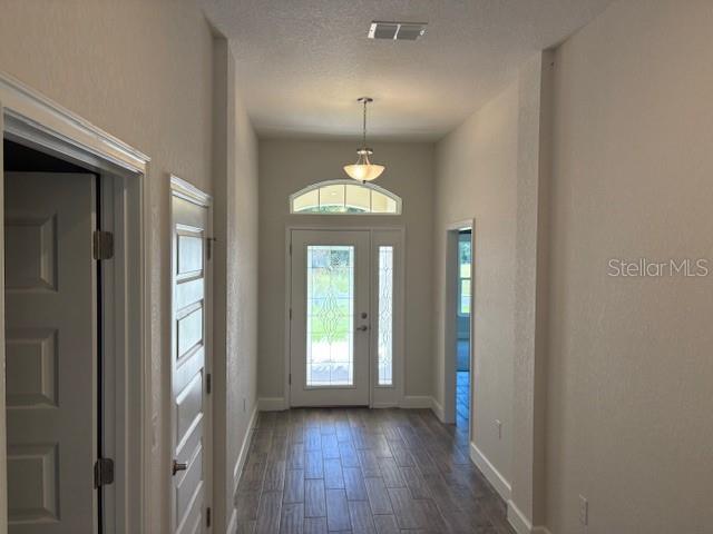 7625 Southwest 180th Circle Dunnellon, FL 34432 - Photo 7 of 21 a view of a room with wooden floor chandelier and windows