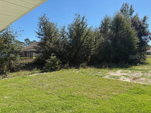 7625 Southwest 180th Circle Dunnellon, FL 34432 - Photo 8 of 21 a backyard of a house with lots of green space