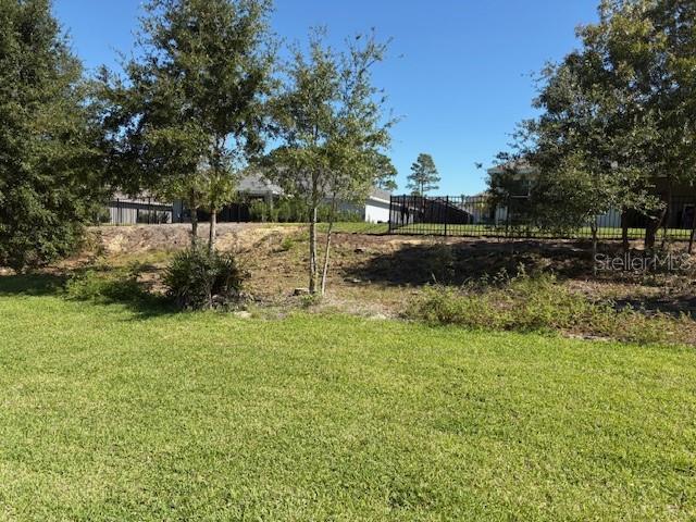 7625 Southwest 180th Circle Dunnellon, FL 34432 - Photo 9 of 21 a view of a yard with trees