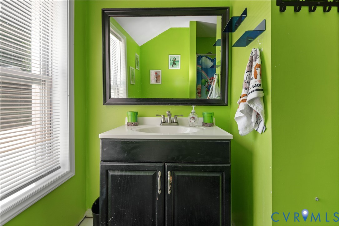 6243 Studley Road Mechanicsville, VA 23116 - Photo 51 of 65 a bathroom with a sink and a mirror