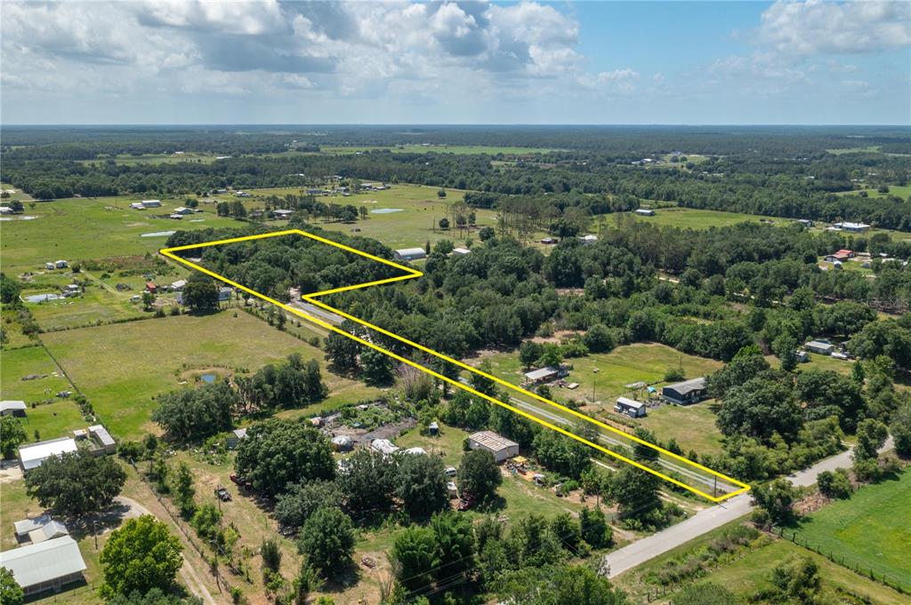 15079 Brahma Road Polk City, FL 33868 - Photo 40 of 40 an aerial view of residential houses with outdoor space and river