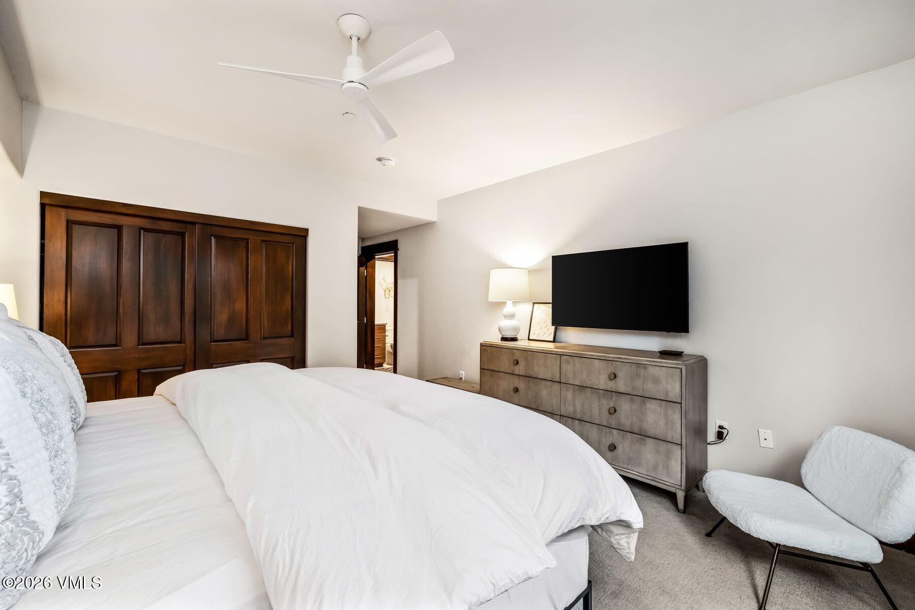 30 Cresta Road, Unit 202 Edwards, CO 81632 - Photo 13 of 23 a bedroom with a bed and a flat screen tv