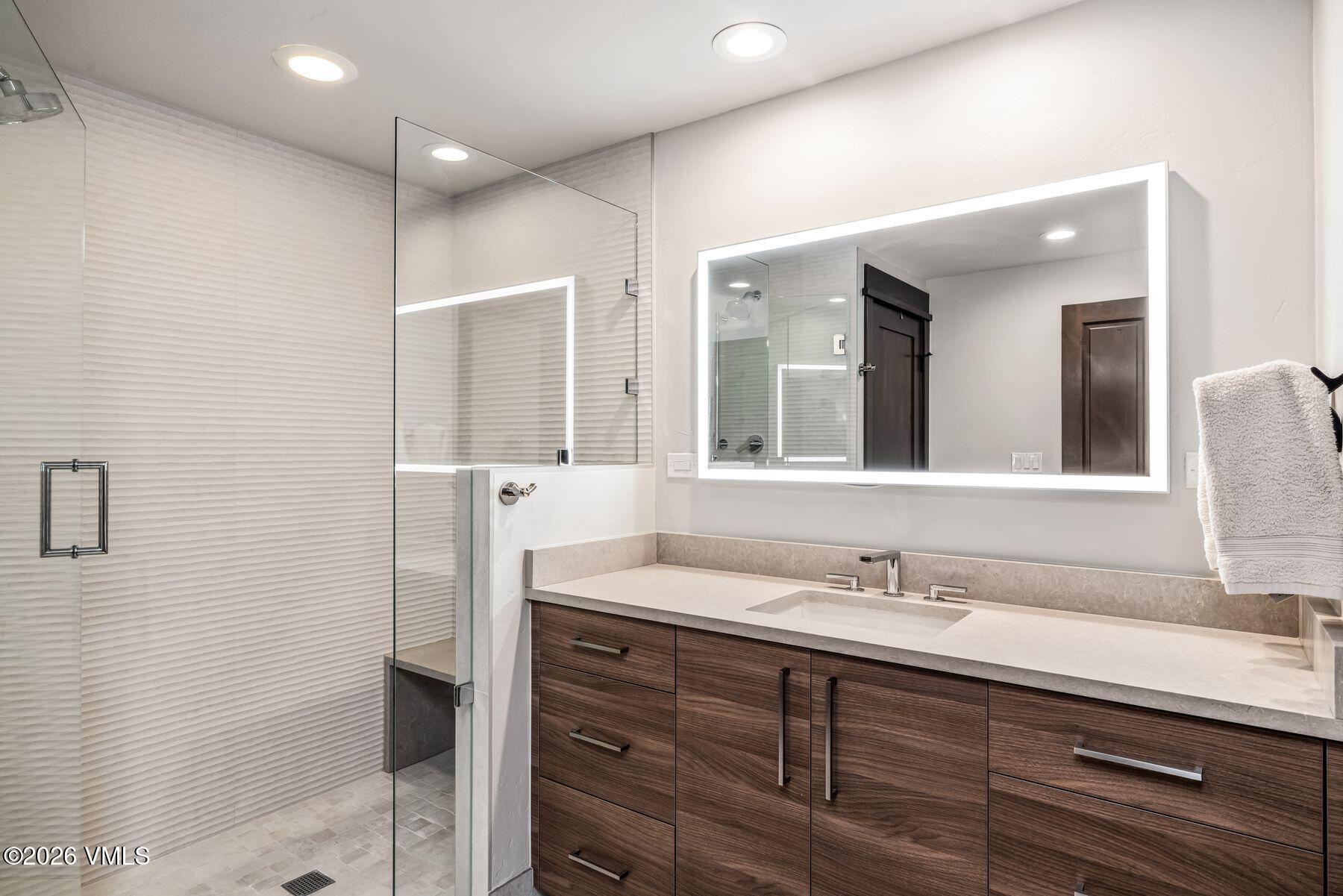 30 Cresta Road, Unit 202 Edwards, CO 81632 - Photo 14 of 23 a bathroom with a double vanity sink and mirror
