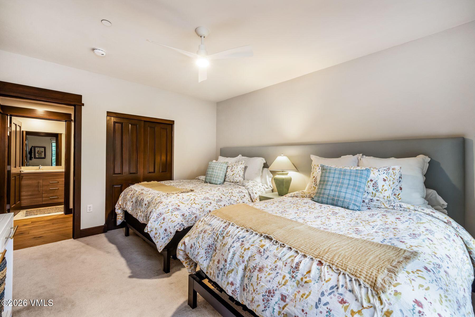 30 Cresta Road, Unit 202 Edwards, CO 81632 - Photo 16 of 23 a bedroom with a bed and large mirror