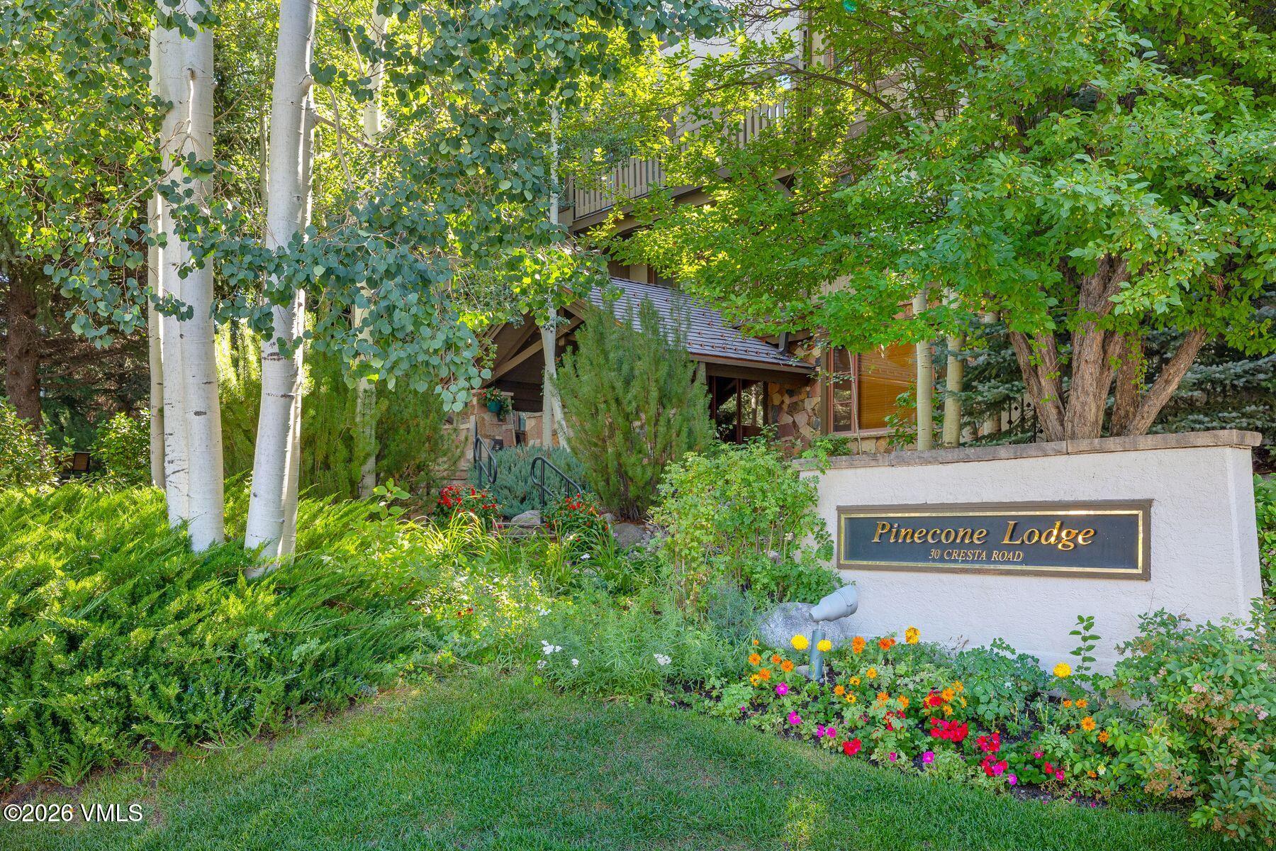 30 Cresta Road, Unit 202 Edwards, CO 81632 - Photo 21 of 23 a view of sign board with plants and trees