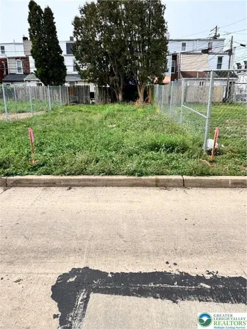 a view of a yard with an outdoor seating
