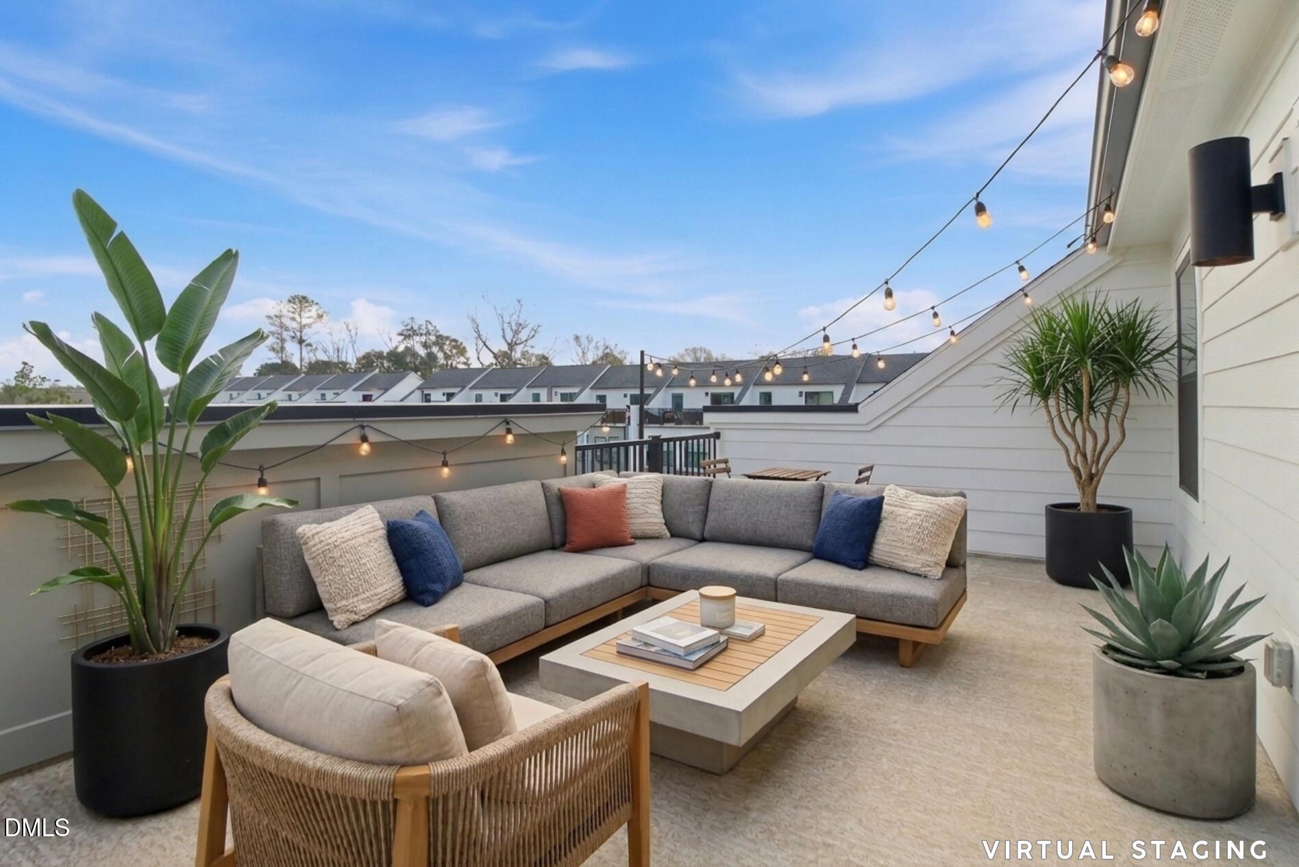 501 Hedrick Ridge Road Cary, NC 27519 - Photo 39 of 47 a view of a terrace with couches and a potted plant
