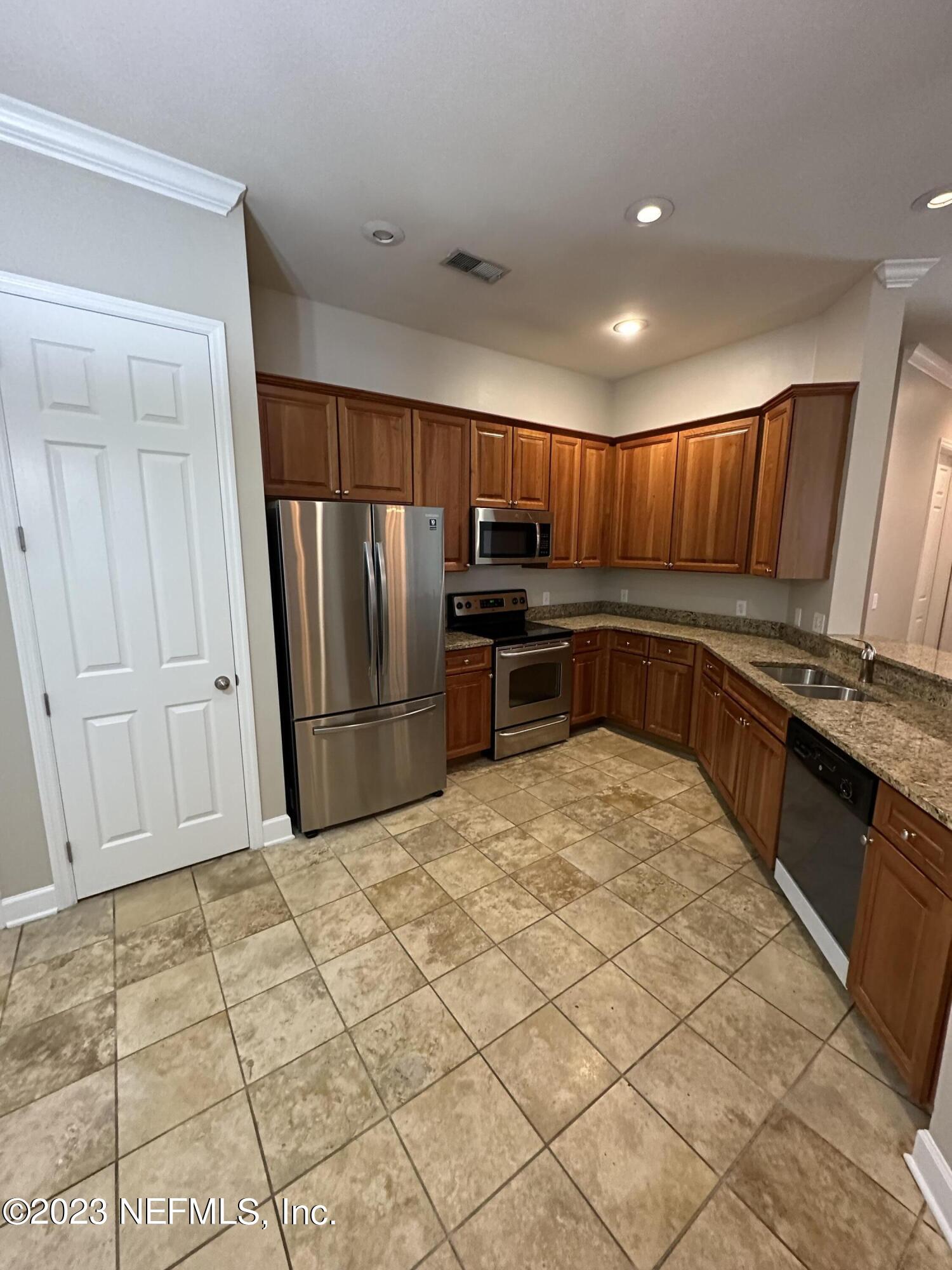 2014 Pond Ridge Court, Unit 1104 Fleming Island, FL 32003 - Photo 12 of 35 Kitchen w/pantry