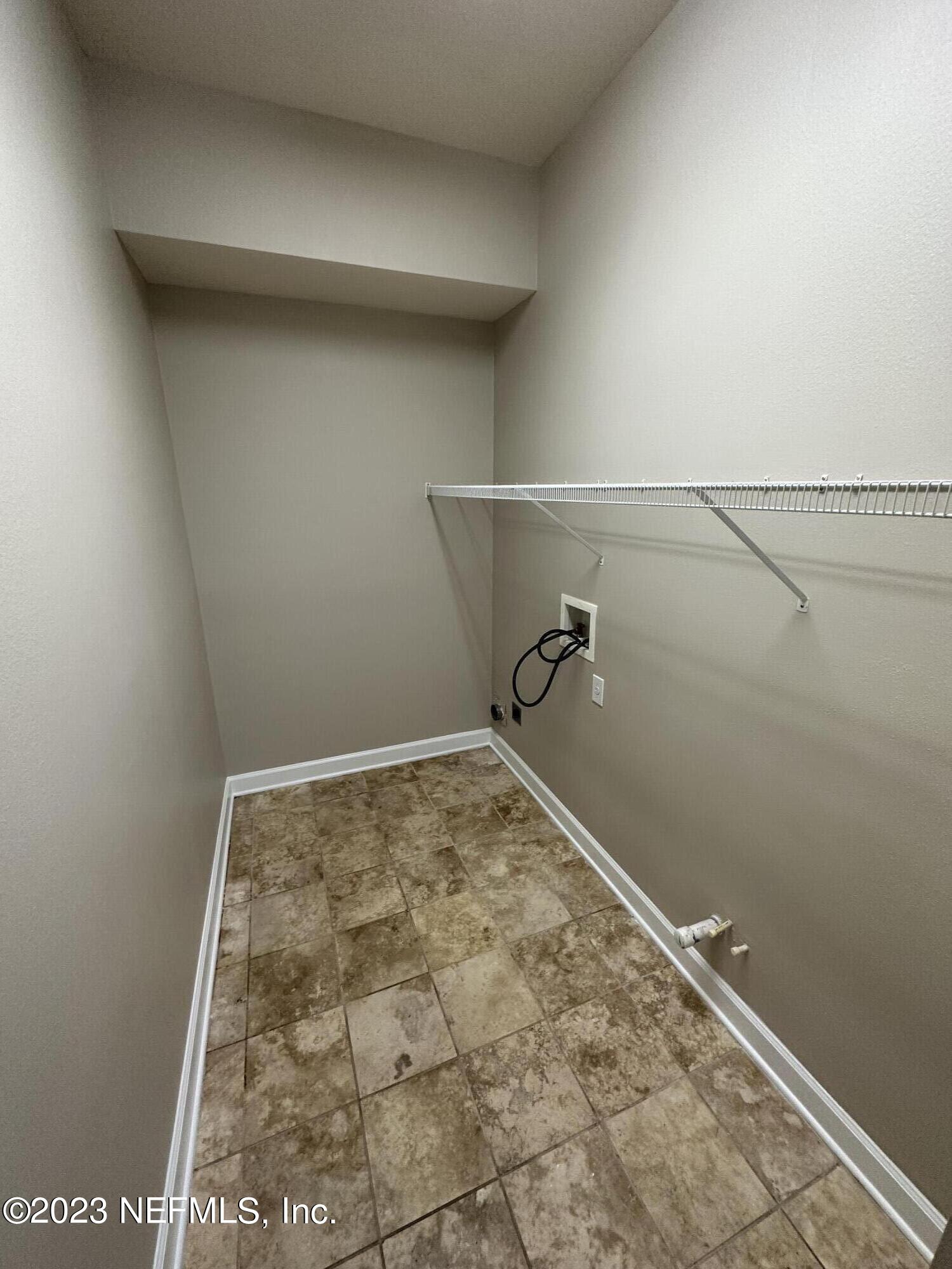 2014 Pond Ridge Court, Unit 1104 Fleming Island, FL 32003 - Photo 14 of 35 Laundry Room by kitchen