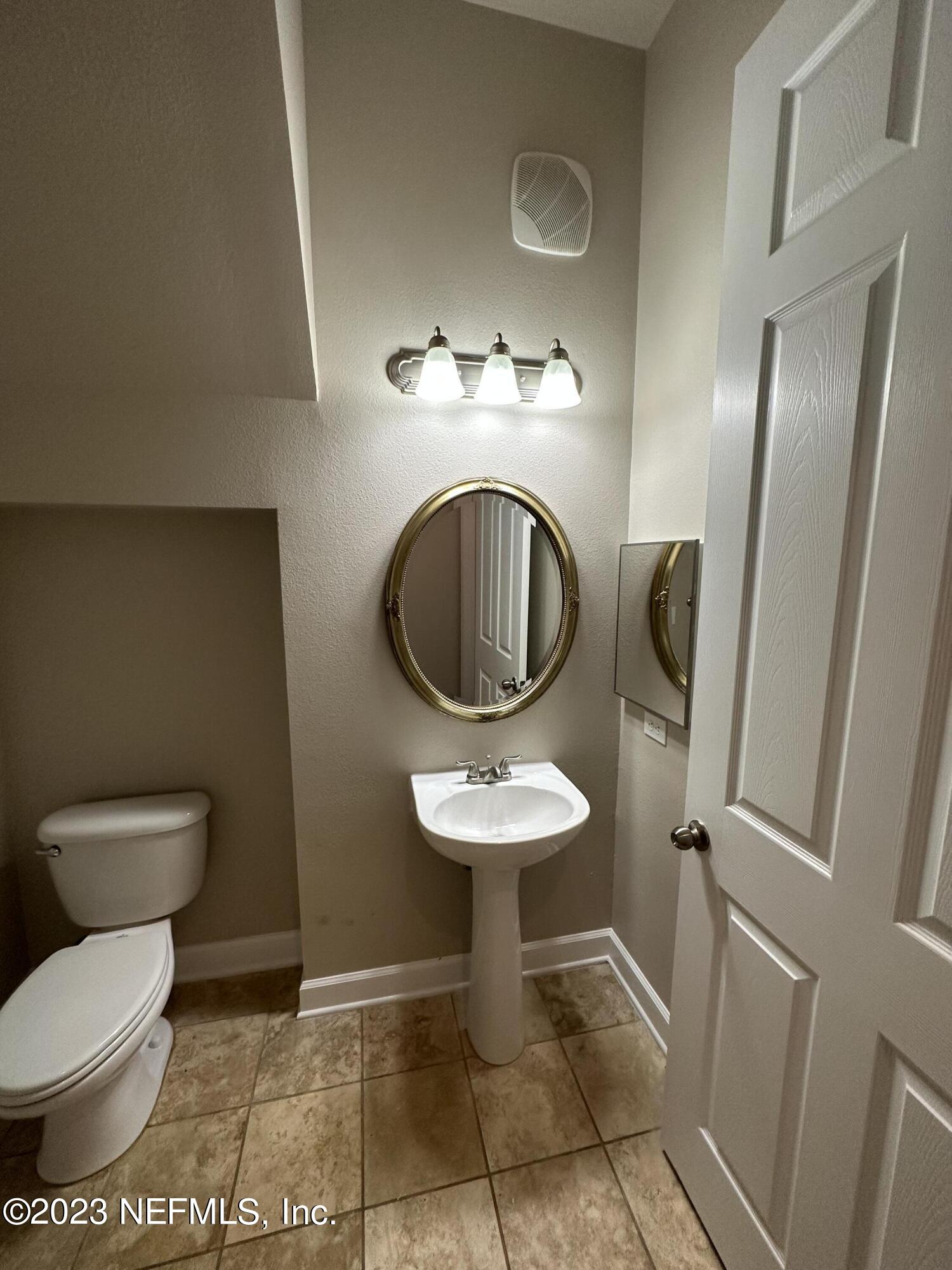 2014 Pond Ridge Court, Unit 1104 Fleming Island, FL 32003 - Photo 15 of 35 Downstairs 1/2 bath