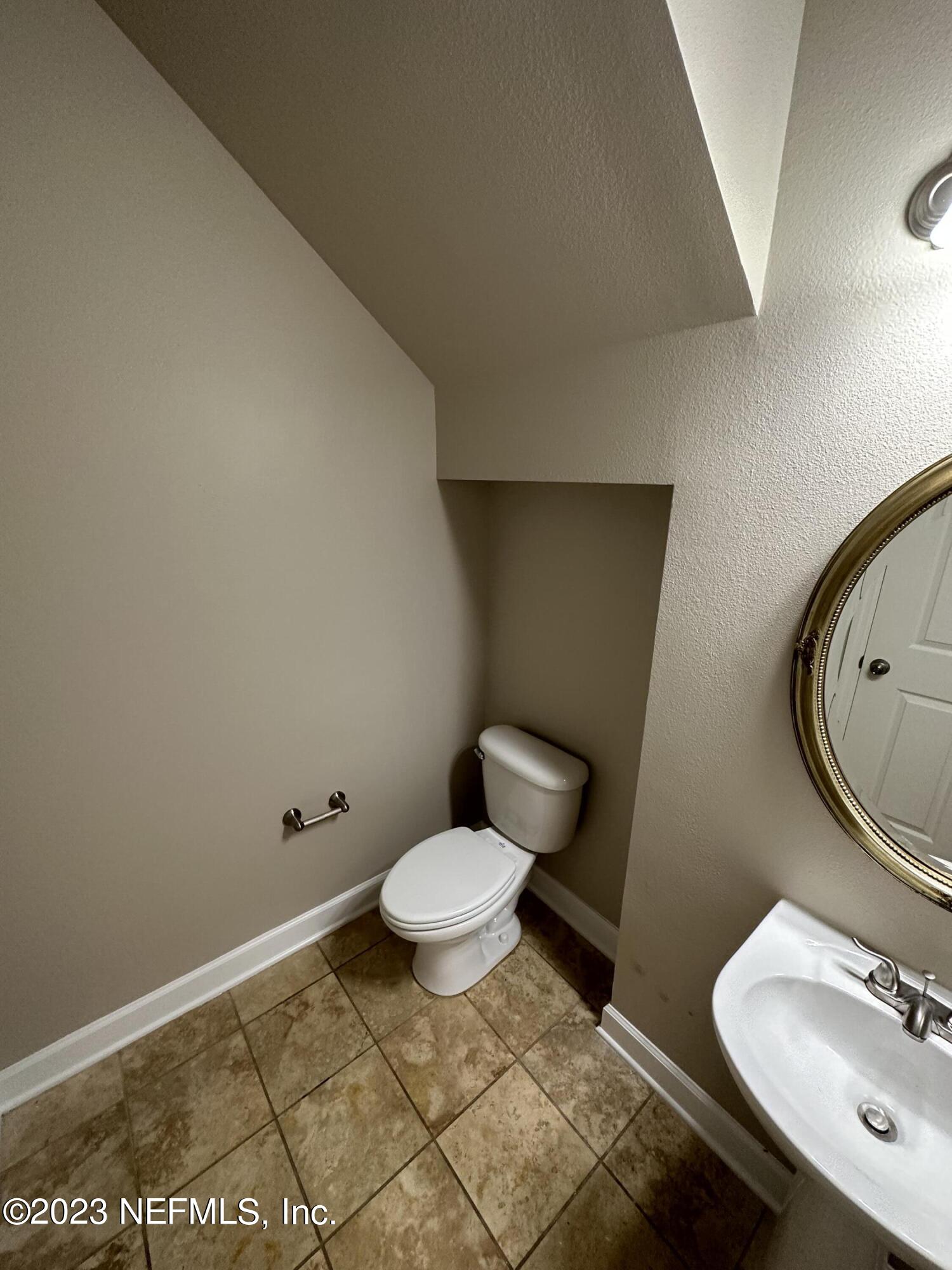 2014 Pond Ridge Court, Unit 1104 Fleming Island, FL 32003 - Photo 16 of 35 Downstair 1/2 bath