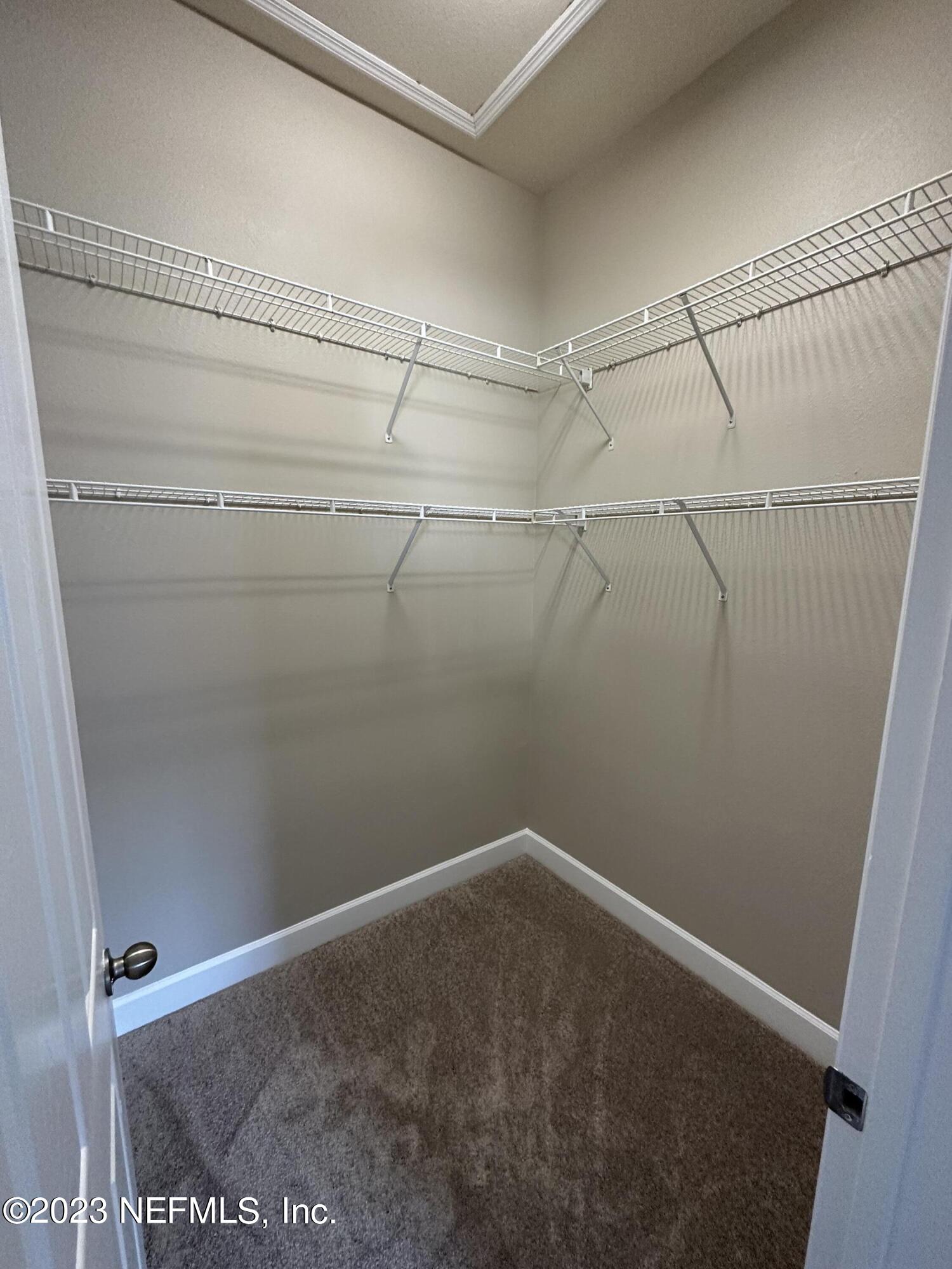 2014 Pond Ridge Court, Unit 1104 Fleming Island, FL 32003 - Photo 27 of 35 2nd bedroom closet