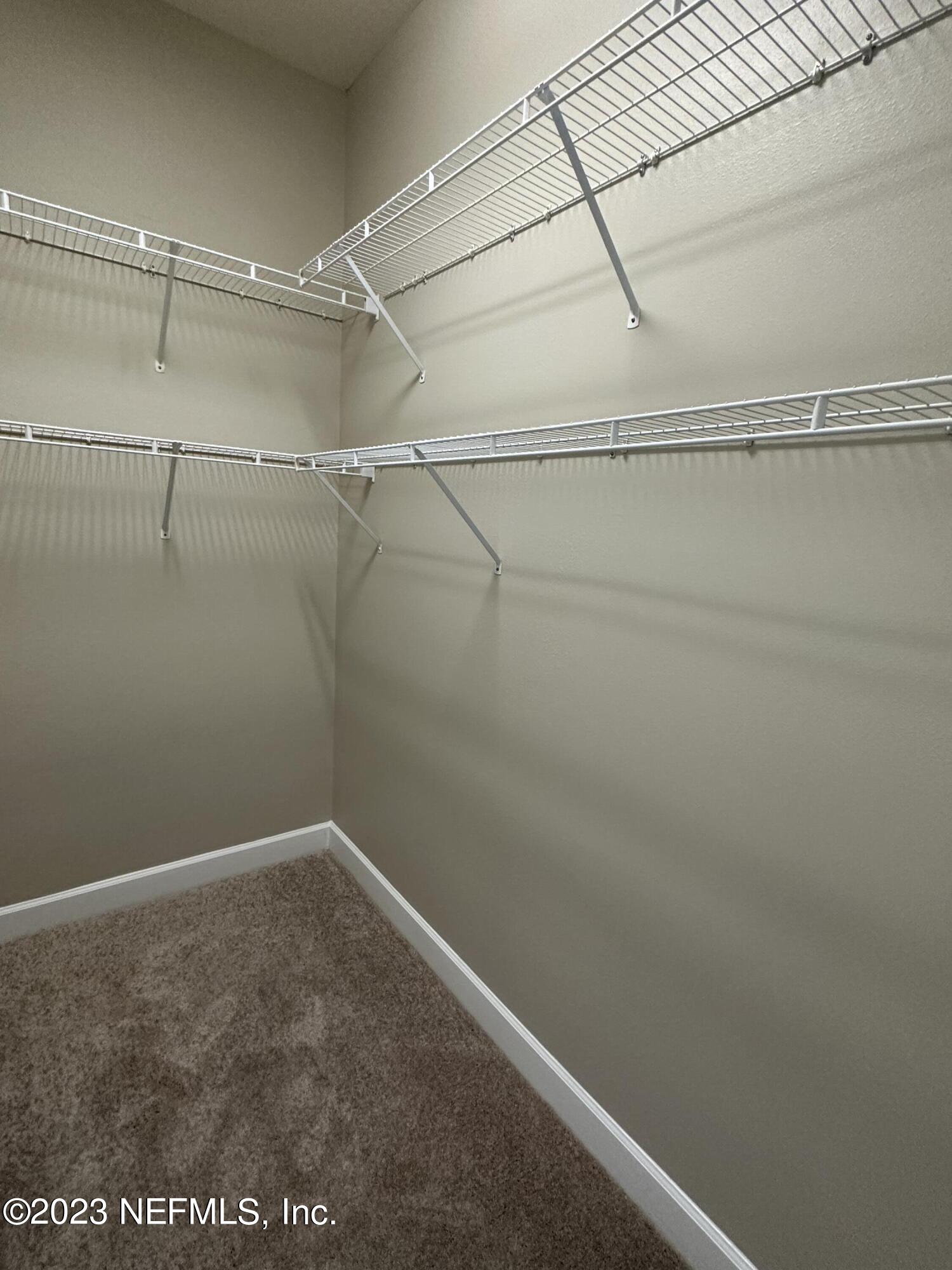 2014 Pond Ridge Court, Unit 1104 Fleming Island, FL 32003 - Photo 32 of 35 3rd bedroom closet