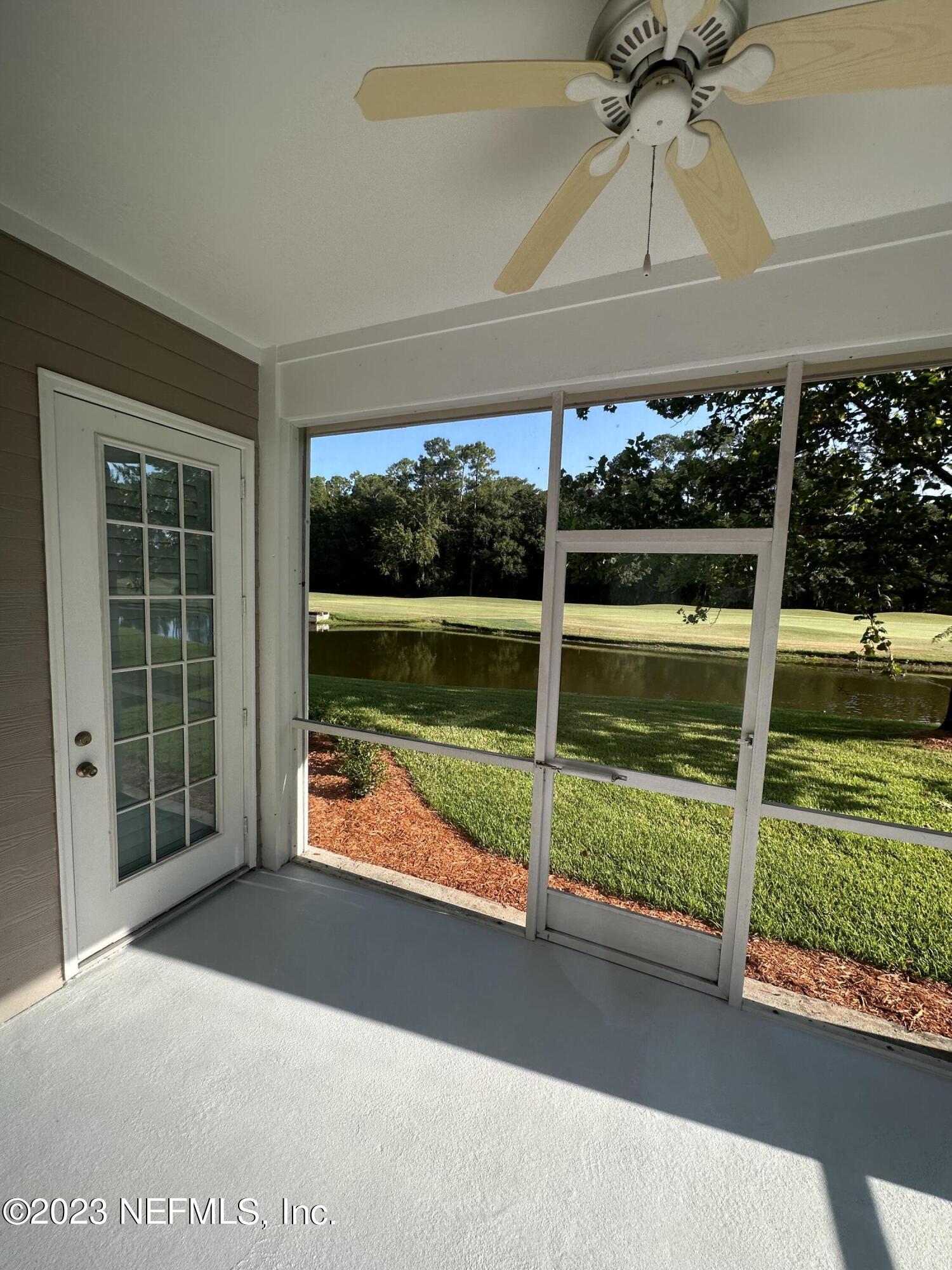 2014 Pond Ridge Court, Unit 1104 Fleming Island, FL 32003 - Photo 4 of 35 Screened patio facing pond