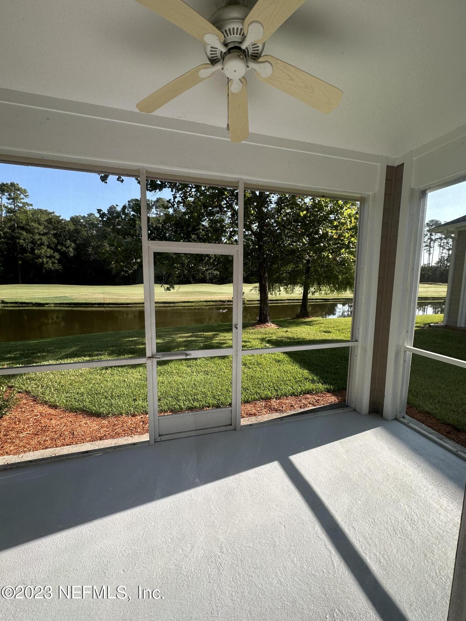 2014 Pond Ridge Court, Unit 1104 Fleming Island, FL 32003 - Photo 5 of 35 Screened patio facing pond