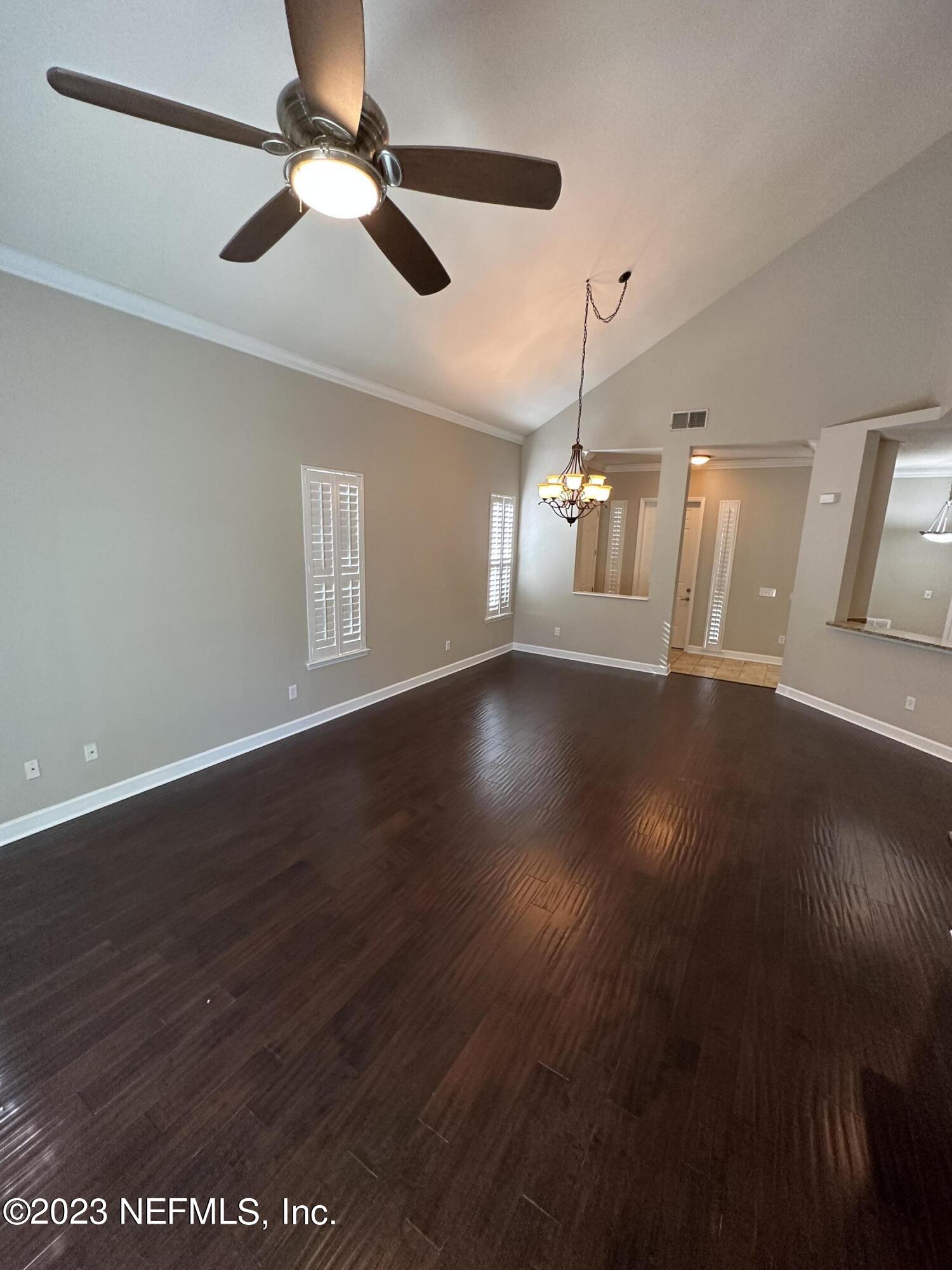 2014 Pond Ridge Court, Unit 1104 Fleming Island, FL 32003 - Photo 10 of 35 Living rm w/wood floors