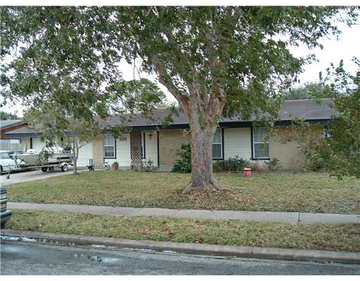 3117 Meadow Ridge Drive Corpus Christi, TX 78418 - Photo 1 of 4 a front view of a house with garden