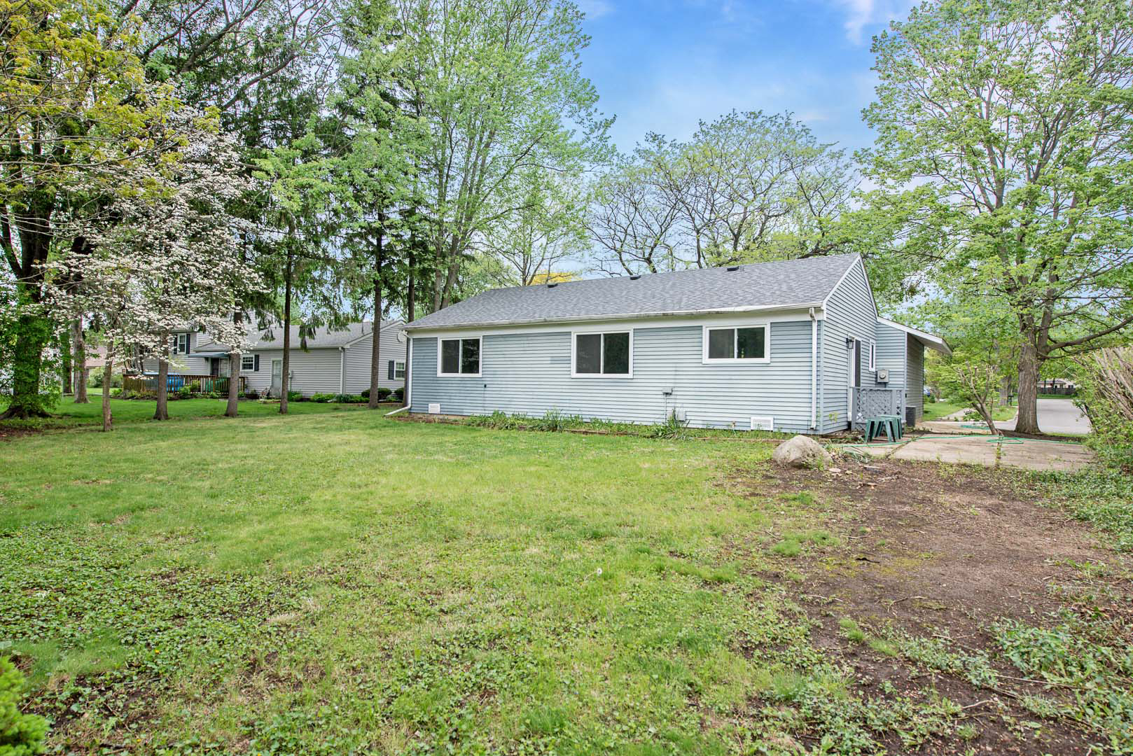 106 Foxcroft Road Naperville, IL 60565 - Photo 21 of 21 a view of a house with a backyard