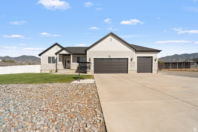 3678 Spiral Springs Road, Unit 204 Tooele, UT 84074 - Photo 3 of 59 Light gray exterior siding with stone accents