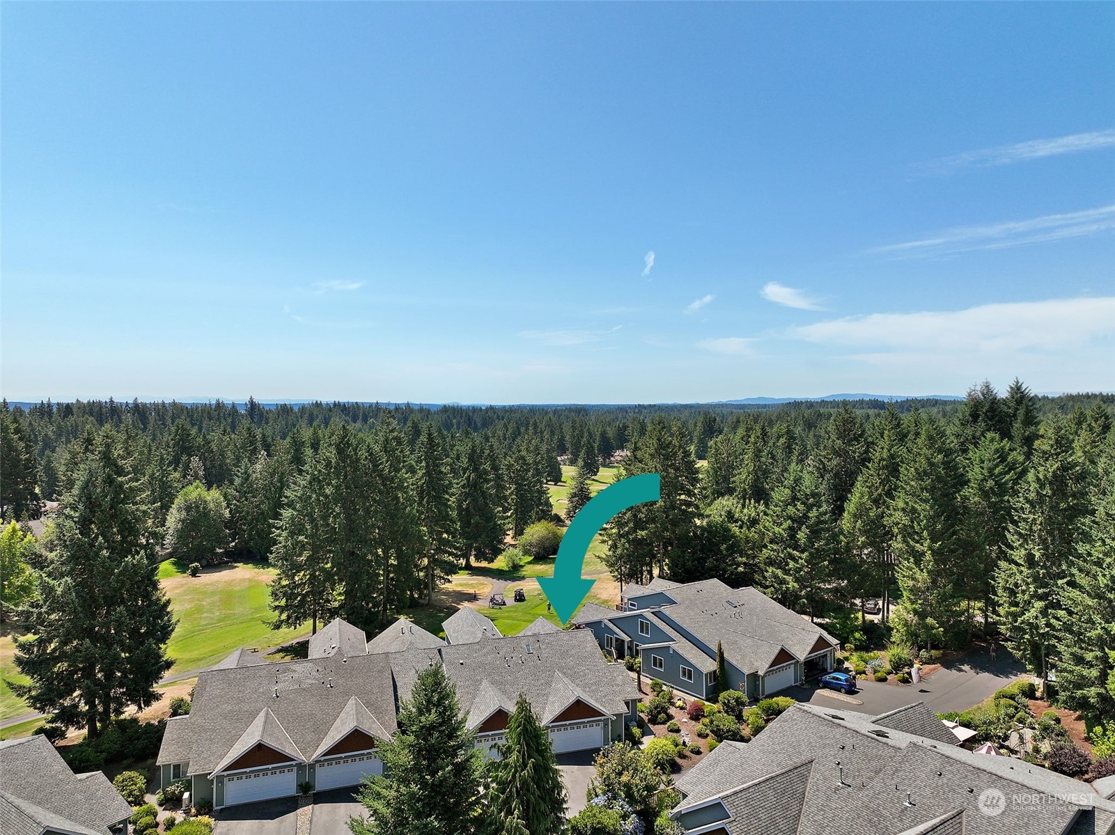91 East Soderberg Road, Unit C10 Allyn, WA 98524 - Photo 33 of 38 an aerial view of a house with lots of trees in front