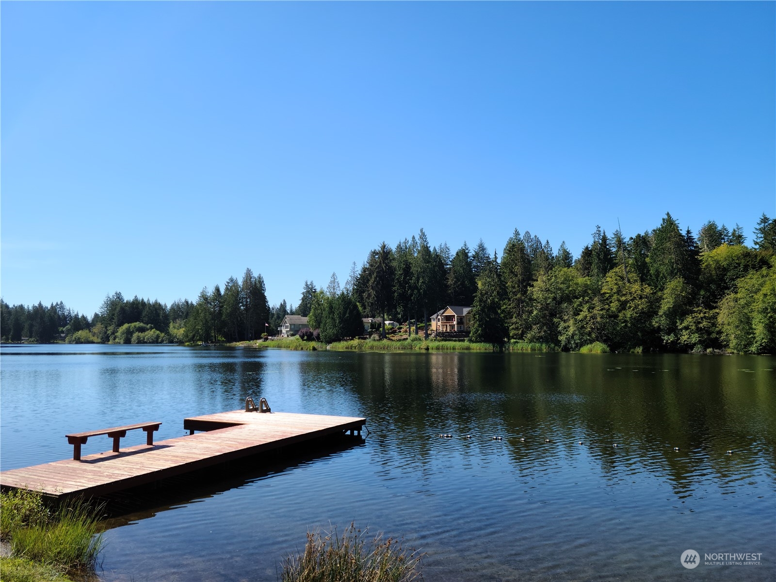 91 East Soderberg Road, Unit C10 Allyn, WA 98524 - Photo 36 of 38 a view of a lake with sitting area and lake view