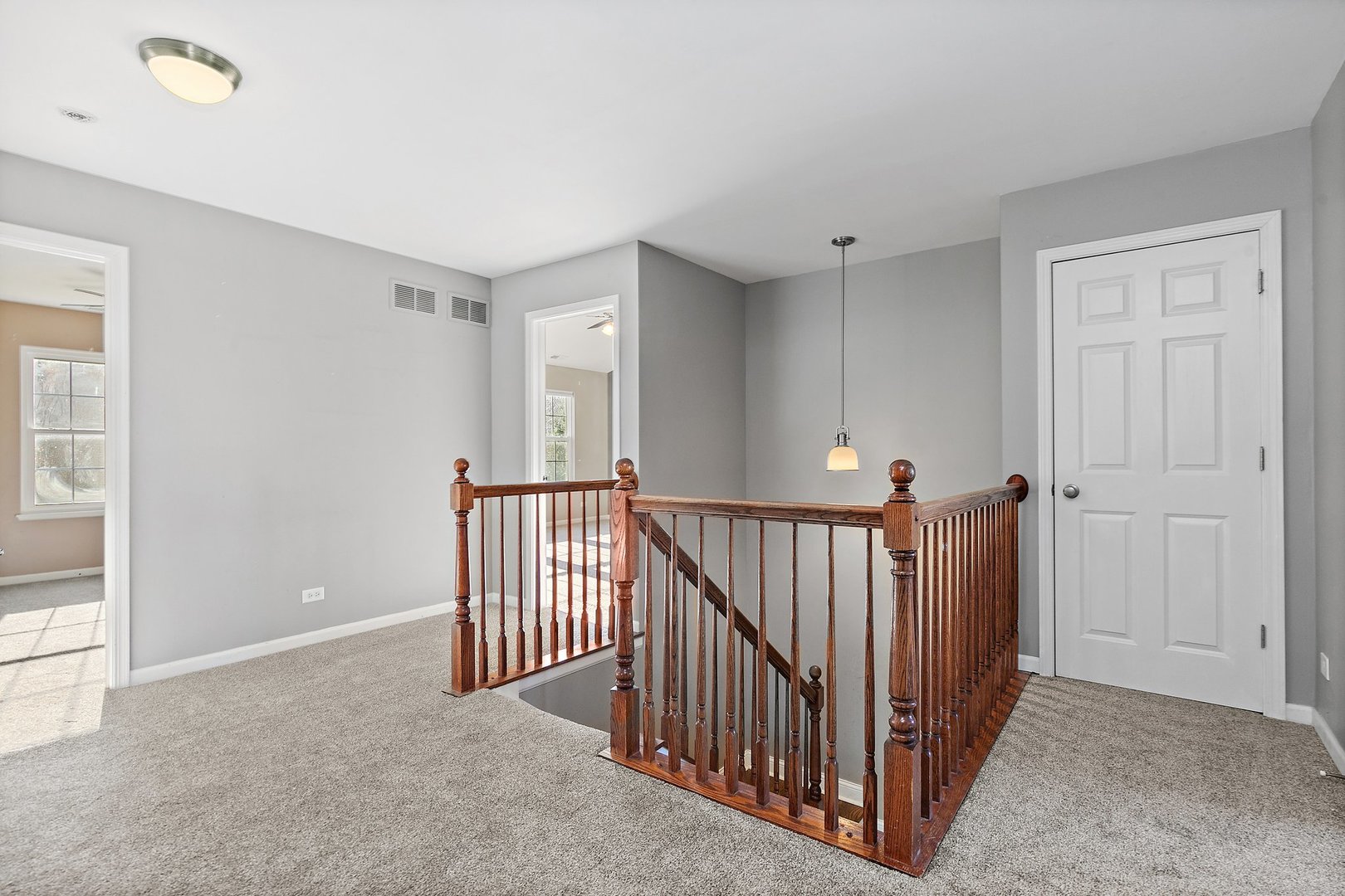 345 Shadow Hill Drive Elgin, IL 60124 - Photo 14 of 35 a view of a hallway with a window and stairs