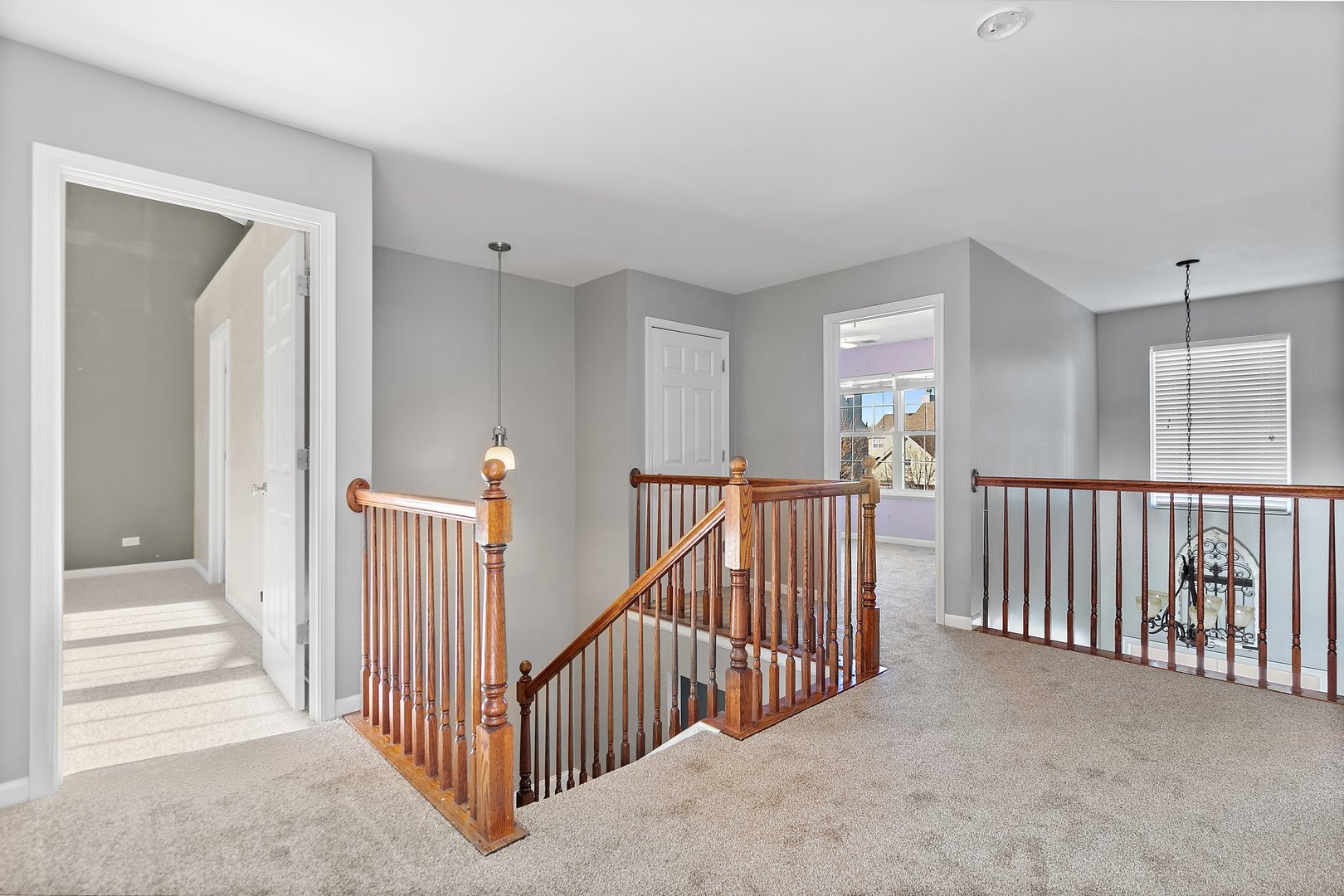 345 Shadow Hill Drive Elgin, IL 60124 - Photo 15 of 35 a view of a hallway with windows and stairs
