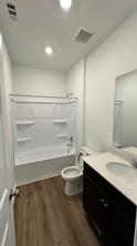 637 The Ugly Way Jarrell, TX 76537 - Photo 11 of 15 a bathroom with a sink a toilet and a tub