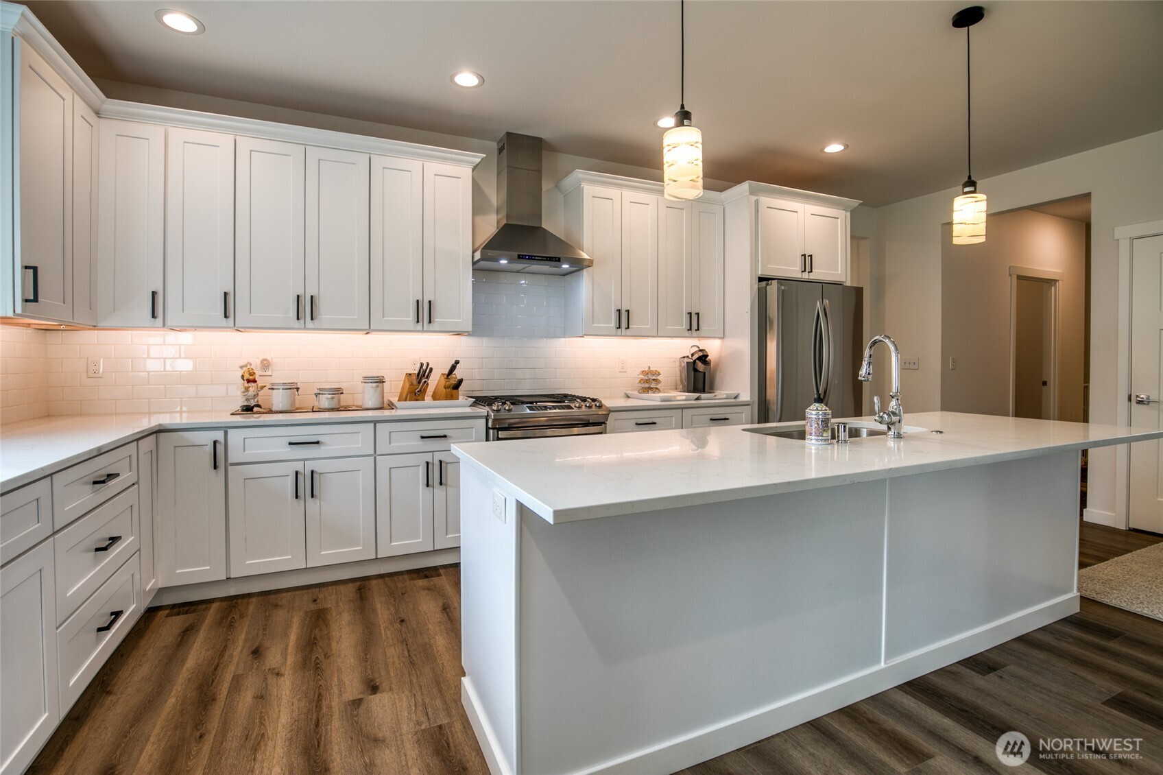 28 Roup Road Montesano, WA 98563 - Photo 13 of 40 a kitchen with kitchen island granite countertop a sink cabinets and stainless steel appliances