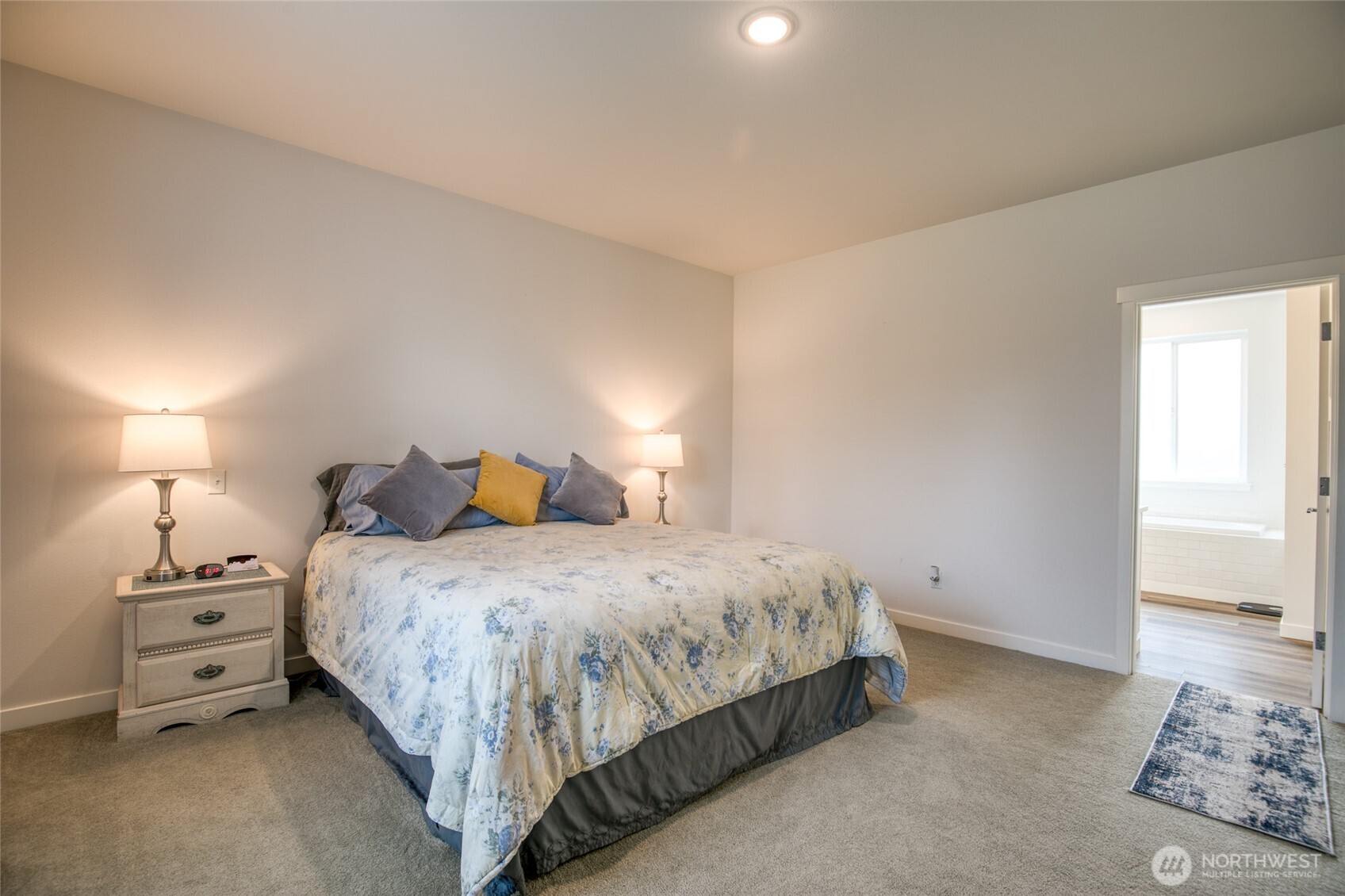28 Roup Road Montesano, WA 98563 - Photo 17 of 40 a bedroom with a bed and a lamp
