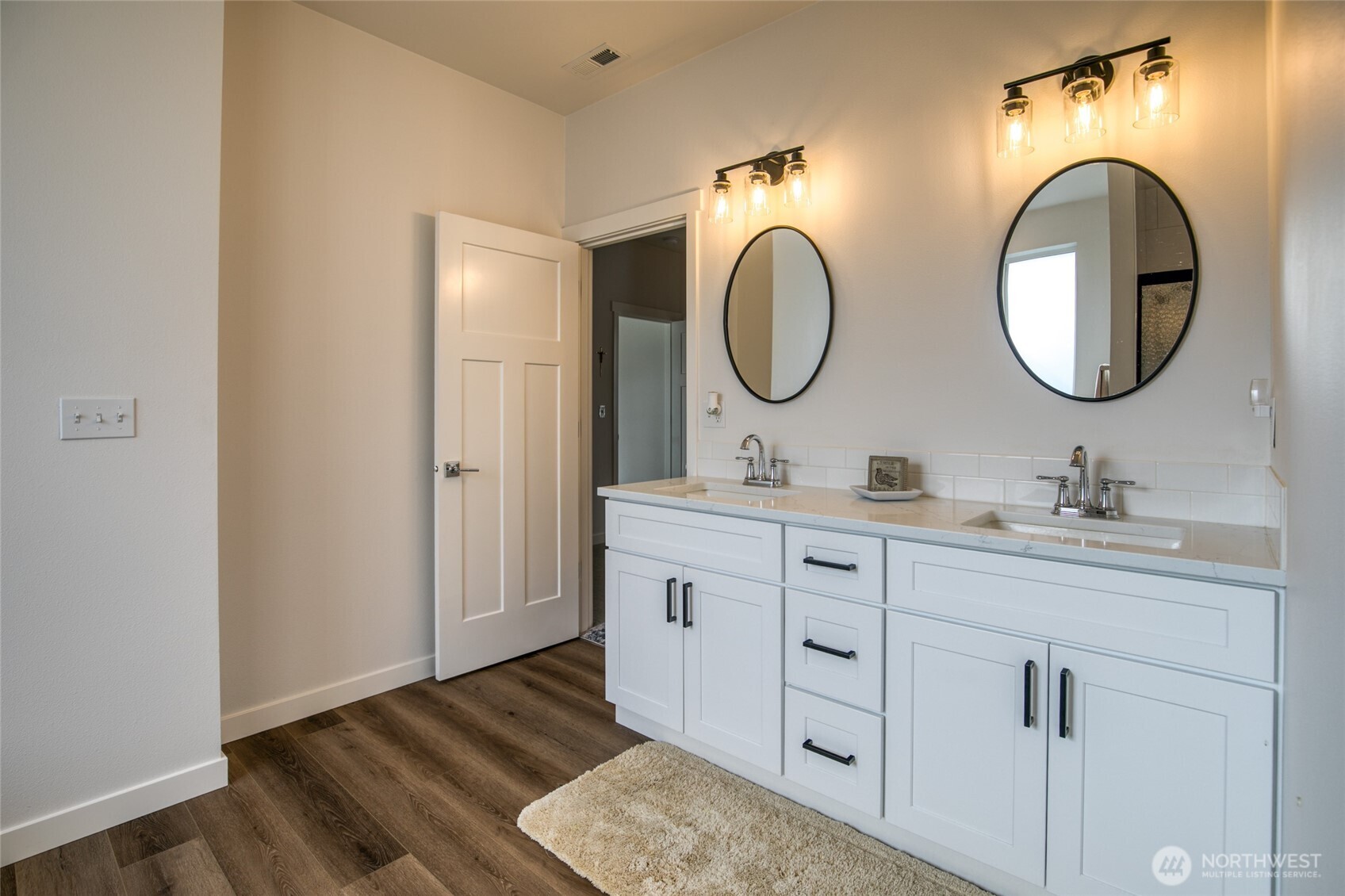 28 Roup Road Montesano, WA 98563 - Photo 20 of 40 a bathroom with a double vanity sink and a mirror