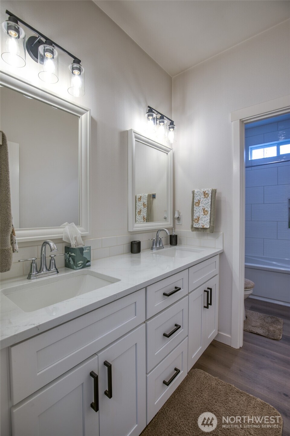 28 Roup Road Montesano, WA 98563 - Photo 26 of 40 a bathroom with double sink and a mirror