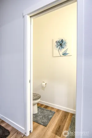 a bathroom with a sink a toilet and a mirror