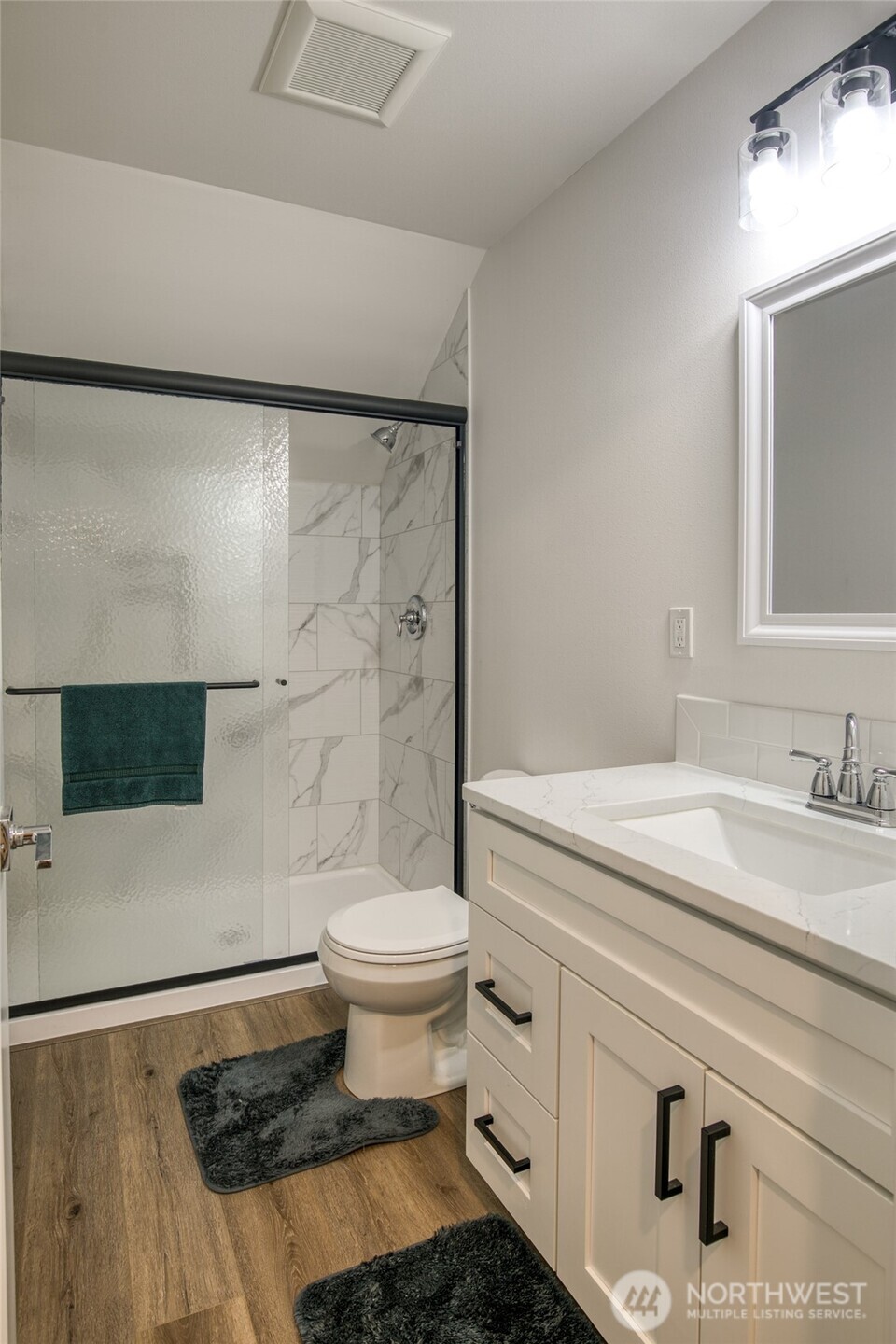 28 Roup Road Montesano, WA 98563 - Photo 30 of 40 a bathroom with a sink a toilet and a mirror