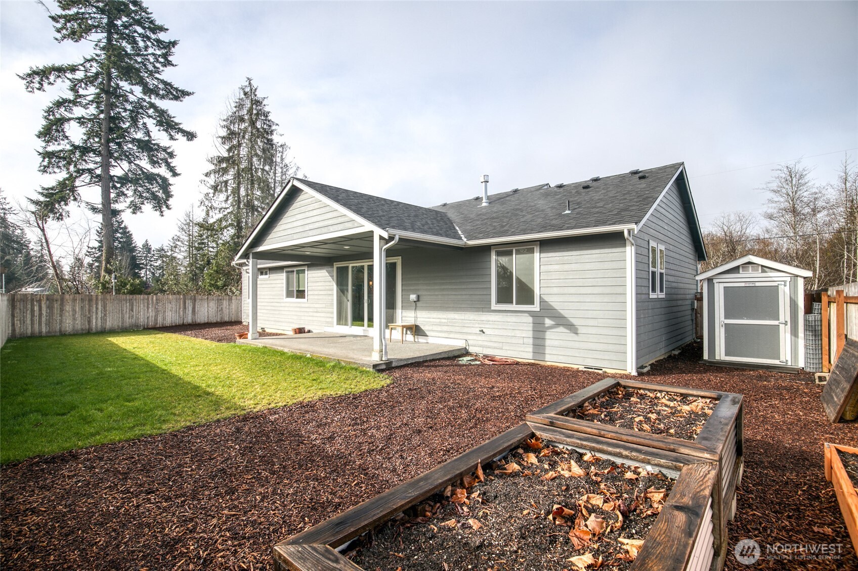 28 Roup Road Montesano, WA 98563 - Photo 39 of 40 a view of a house with backyard and sitting area