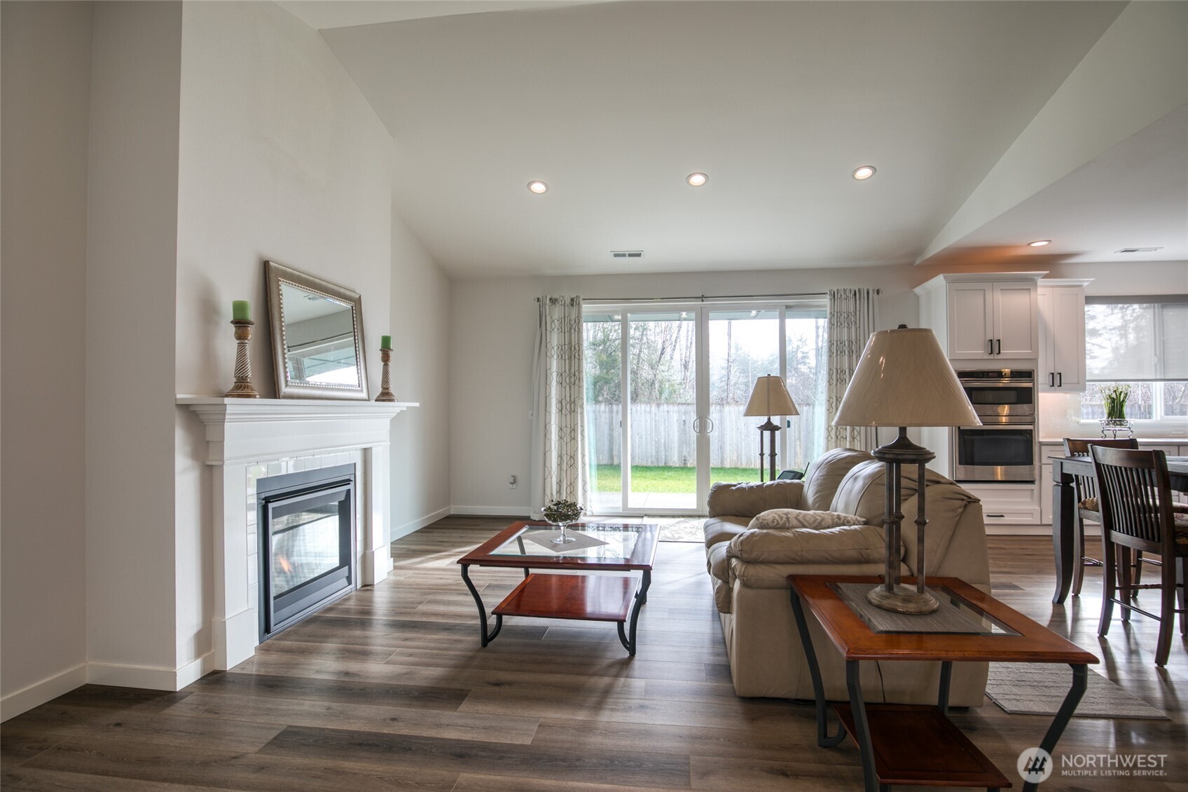 28 Roup Road Montesano, WA 98563 - Photo 7 of 40 a living room with furniture a fireplace and a floor to ceiling window