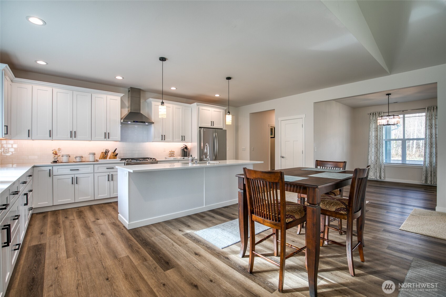 28 Roup Road Montesano, WA 98563 - Photo 10 of 40 a kitchen with stainless steel appliances granite countertop a kitchen island hardwood floor sink stove dining table and chairs