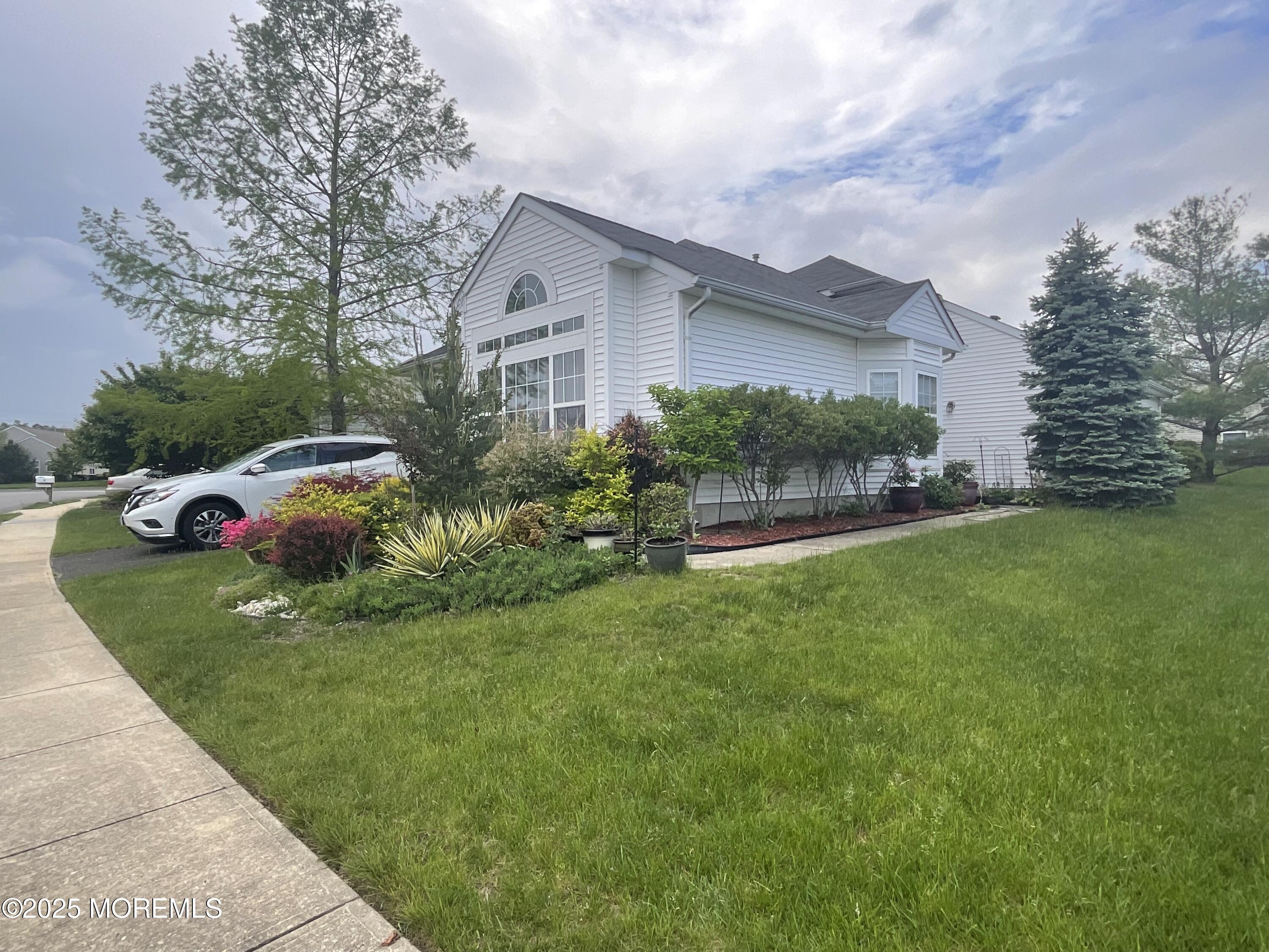 6 Ravenna Road Manchester Township, NJ 08759 - Photo 5 of 14 a front view of a house with a garden and plants