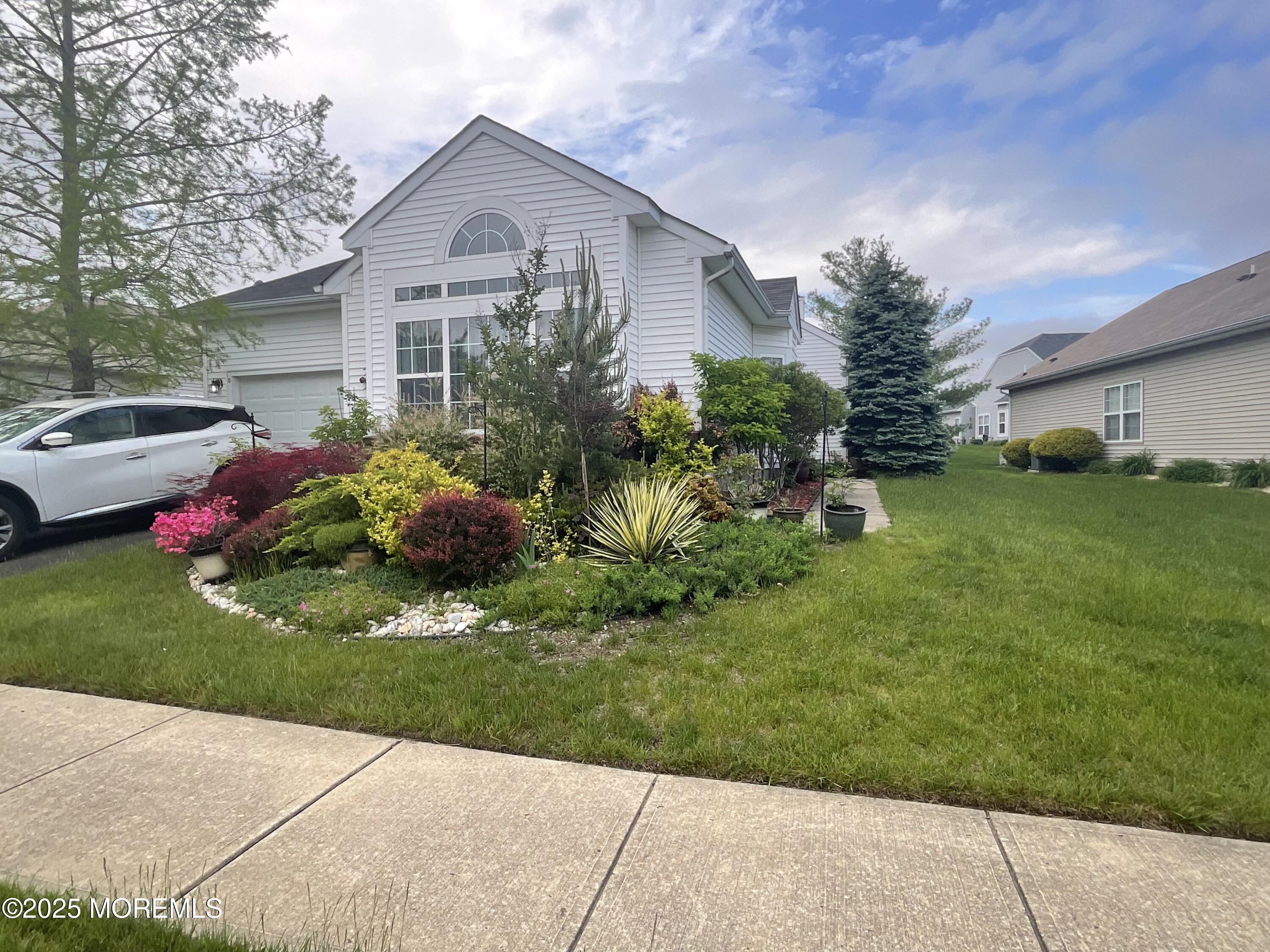 6 Ravenna Road Manchester Township, NJ 08759 - Photo 7 of 14 a front view of a house with a garden