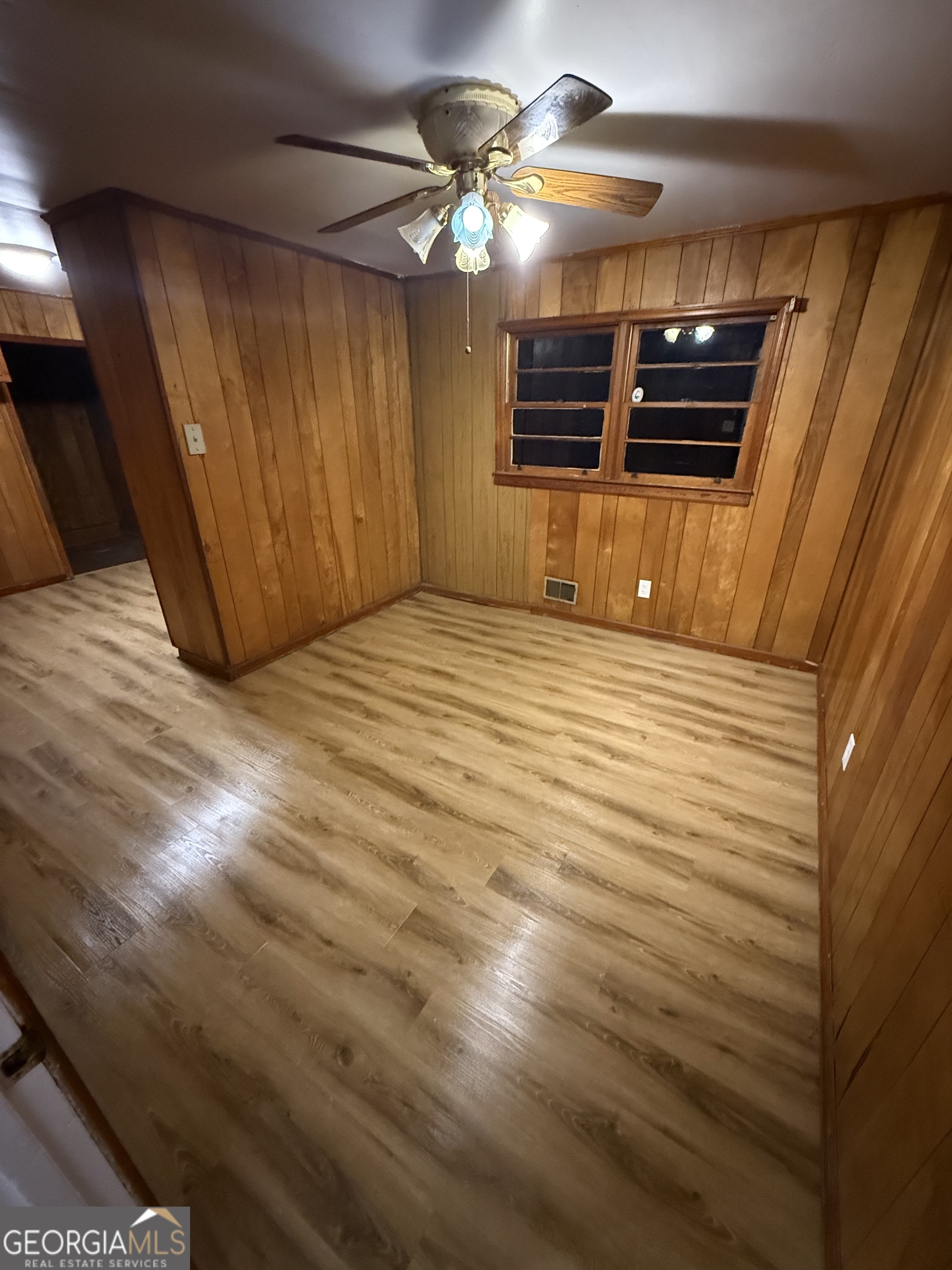 193 Brownlee Road Jackson, GA 30233 - Photo 5 of 10 a view of empty room with a fireplace and chandelier