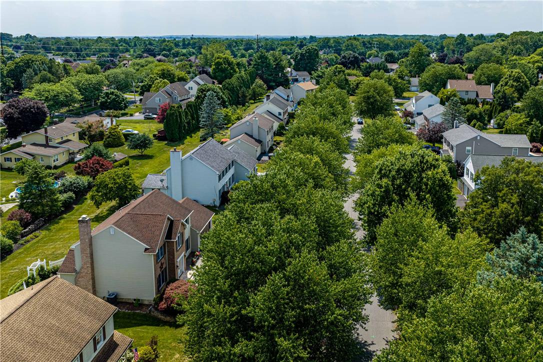 4568 Greenfield Road Bethlehem, PA 18017 - Photo 49 of 59 An aerial perspective reveals a tree-lined neighborhood with well-maintained homes and lush greenery.